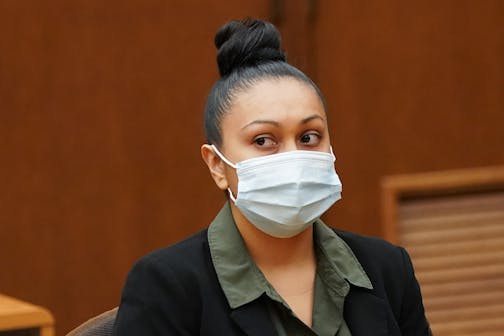 Elsa Segura listened as her defense attorney Amanda Montgomery spoke before sentencing.  Former Hennepin County probation officer, Elsa Segura, is sentenced, Tuesday, Nov. 9, 2021, in Hennepin County Court,  Minneapolis, Minn., for luring Realtor, Monique Baugh, to a fake home showing where she was kidnapped and murdered.