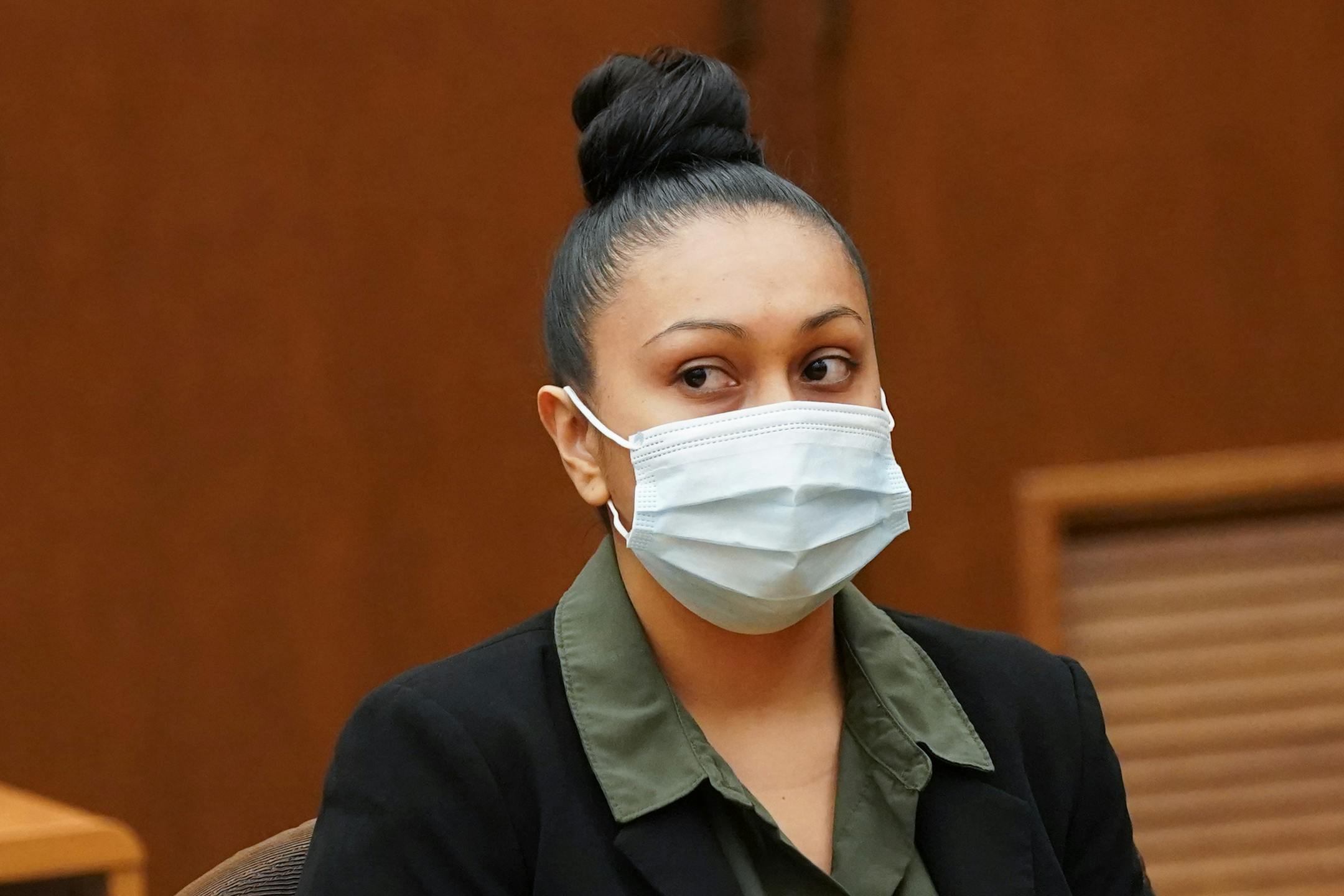 Elsa Segura listened as her defense attorney Amanda Montgomery spoke before sentencing.  Former Hennepin County probation officer, Elsa Segura, is sentenced, Tuesday, Nov. 9, 2021, in Hennepin County Court,  Minneapolis, Minn., for luring Realtor, Monique Baugh, to a fake home showing where she was kidnapped and murdered.