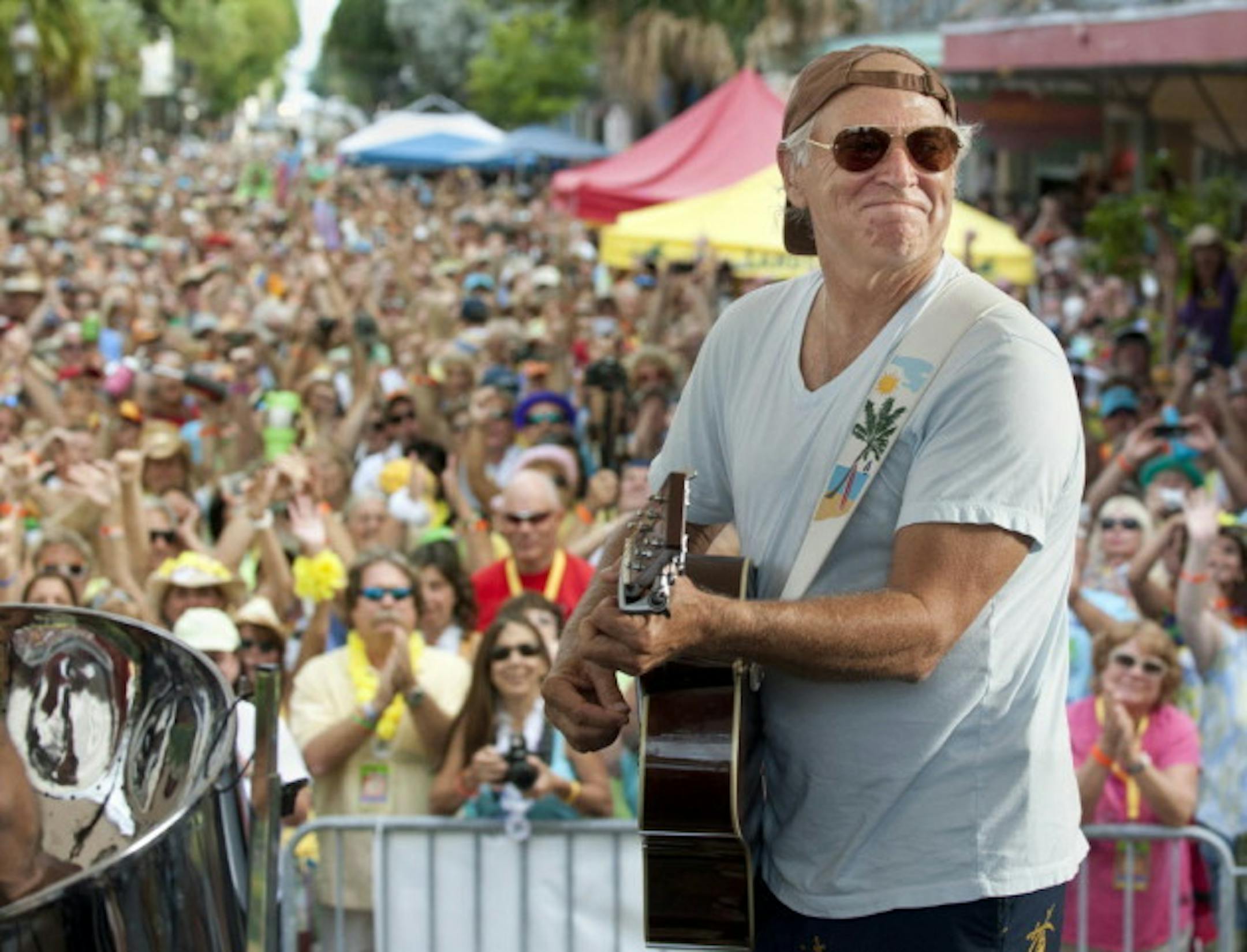Jimmy Buffett performed to fans that swarmed Key West, Fla., in 2011 for the Parrotheads Convention. / AP Photo, Rob O'Neal