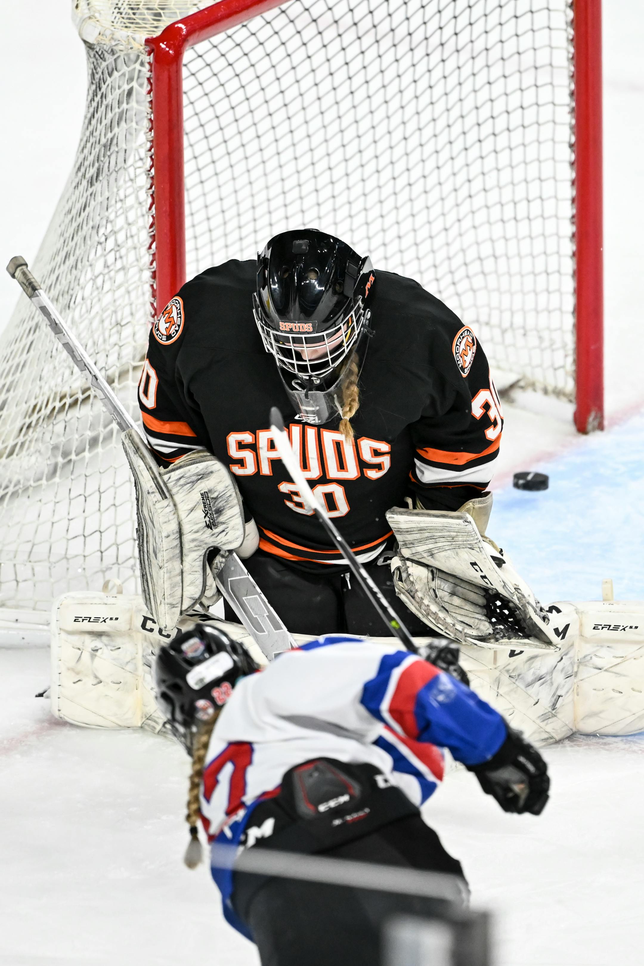 Gentry forward Grace Delmonico (22) scores a goal against Moorhead goaltender Taylor Kressin (30) during the third period.
