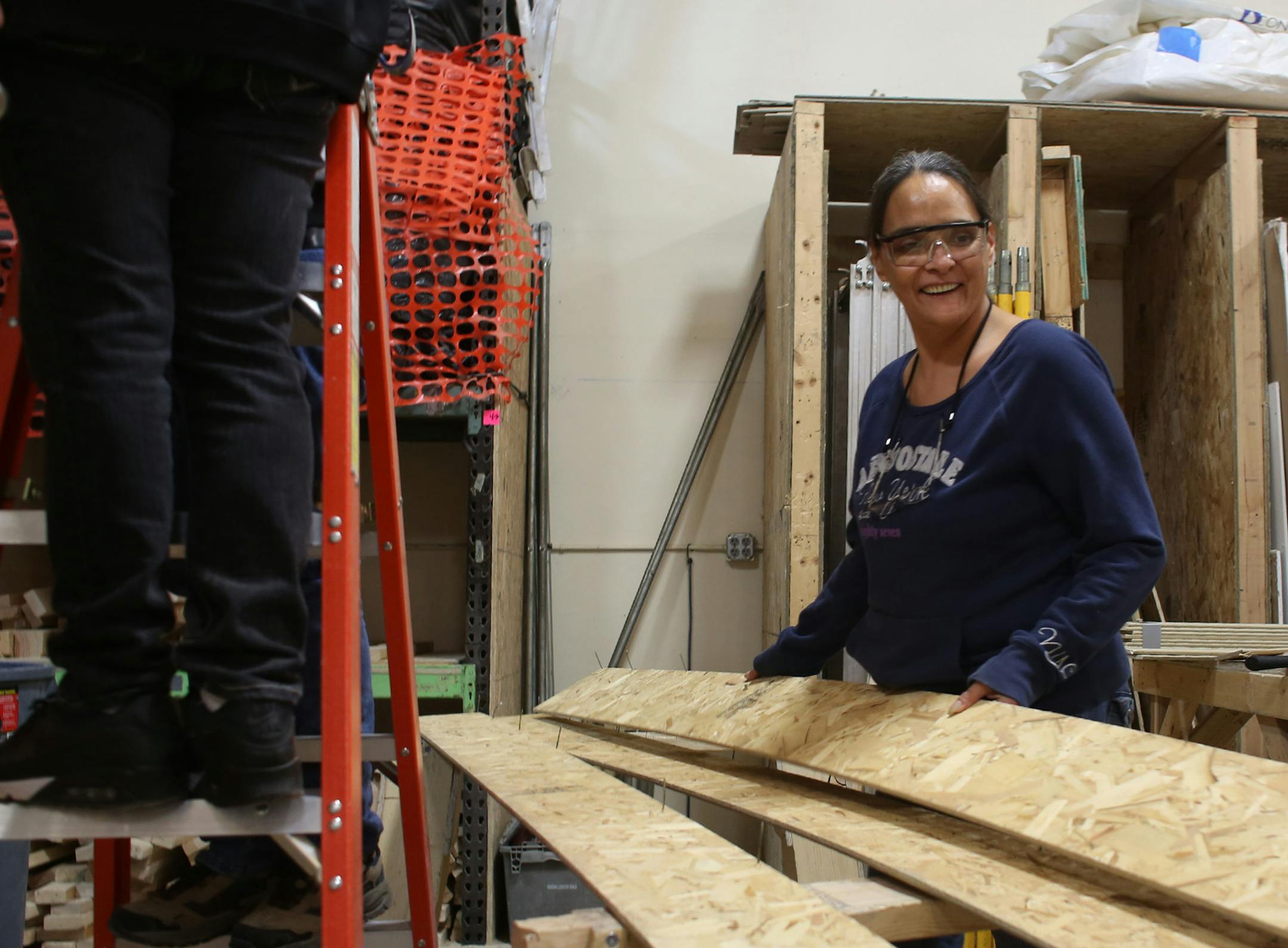 Angela Porter, 46, of St. Paul, hammered the nails out of the boards as she and her classmates deconstruct a house ] (KYNDELL HARKNESS/STAR TRIBUNE) kyndell.harkness@startribune.com A 12 week construction trade program at Goodwill-Easter Seals in St Paul Min., Tuesday, January 6, 2014. The state just invested $500,000 in 7 grants to train women in manufacturing, truck driving and construction. Goal is to boost women's pay and narrow the gender gap.