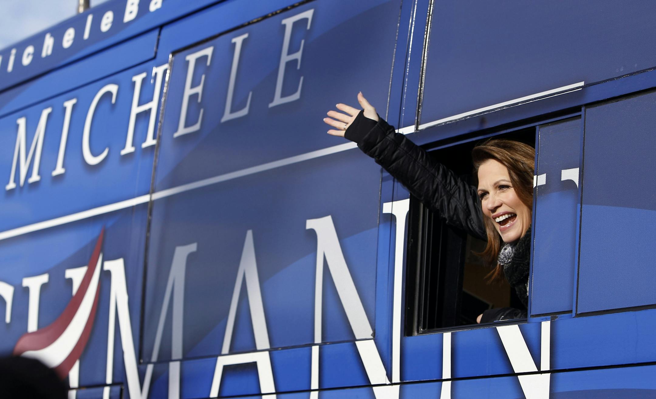 Rep. Michele Bachmann, R-Minn., waves from her bus following a campaign stop at Valley High School, Tuesday, Jan. 3, 2012, in West Des Moines, Iowa.