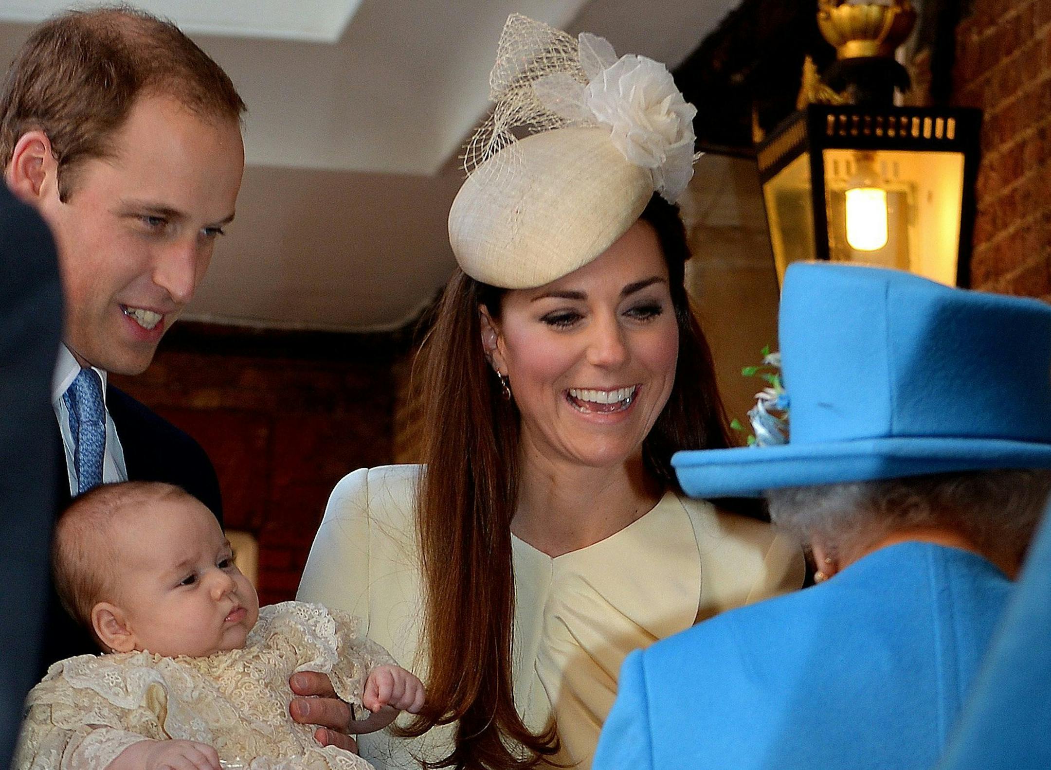 Queen Elizabeth II speaks with the Duke and Duchess of Cambridge with their son Prince George at Chapel Royal in St James's Palace, ahead of the christening of three month-old Prince George of Cambridge by the Archbishop of Canterbury in central London, on October 23, 2013. (John Stillwell/PA Wire/Abaca Press/MCT)