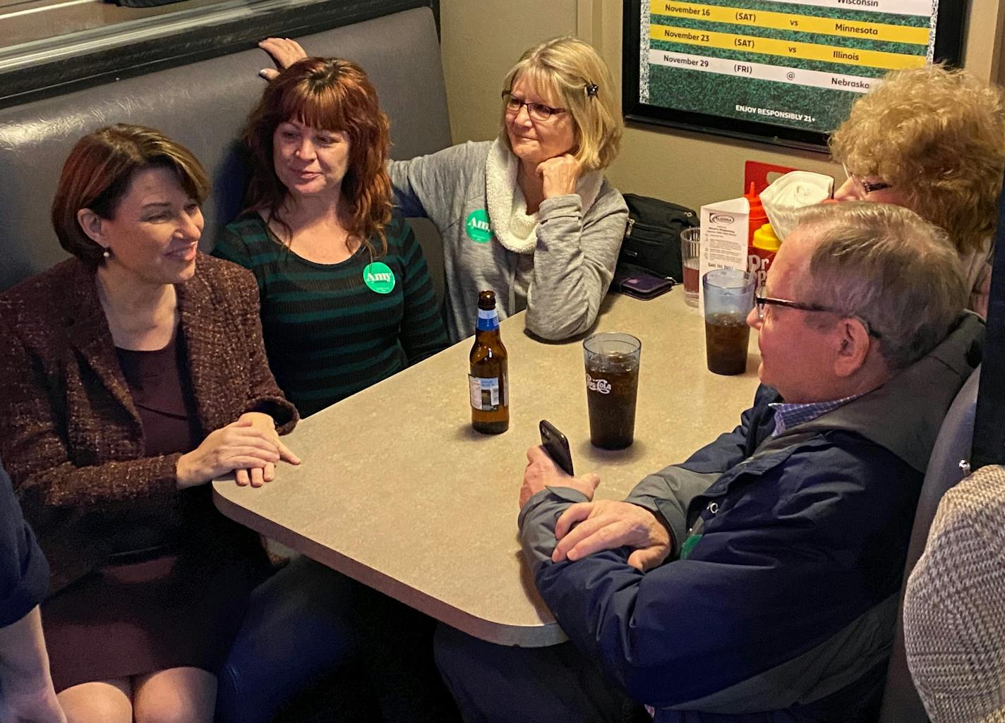 Sen. Amy Klobuchar visits with a group of voters at Miller&#x2019;s Bar and Grill in Algona, Iowa in Kossuth County, the 98th of 99 Iowa counties she visited as a Democratic presidential candidate. ] (Patrick Condon/ Star Tribune)