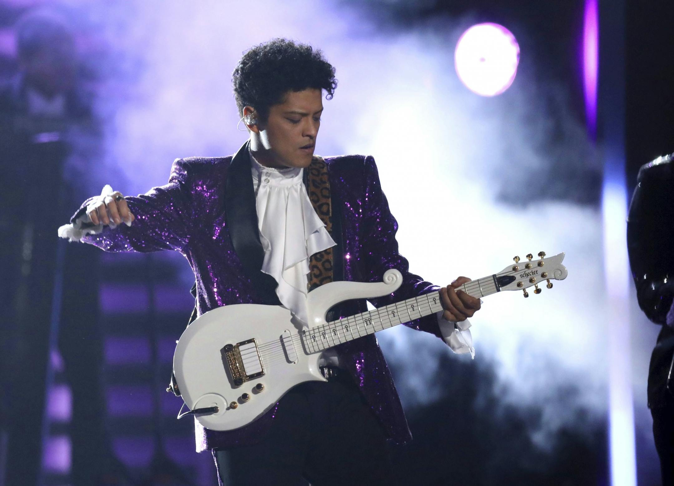 Bruno Mars performs "Let's Go Crazy" during a tribute to Prince at the 59th annual Grammy Awards.
