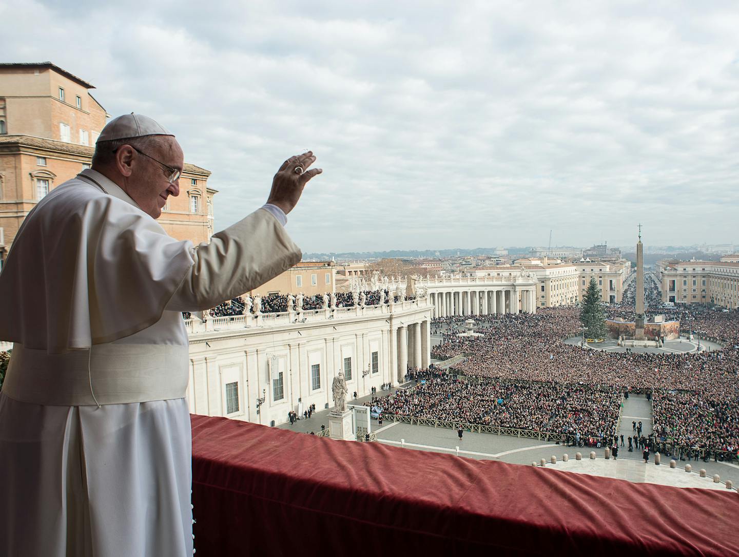 In this picture provided by the Vatican newspaper L'Osservatore Romano, Pope Francis delivers his "Urbi et Orbi" (to the city and to the world) blessing from the central balcony of St. Peter's Basilica at the Vatican, Thursday, Dec. 25, 2014. Tens of thousands of Romans and tourists in St. Peter's Square listened as the pontiff delivered the Catholic church's traditional "Urbi et Orbi" (Latin for "to the city and to the world) Christmas message from the central balcony of St. Peter's Basilica. F