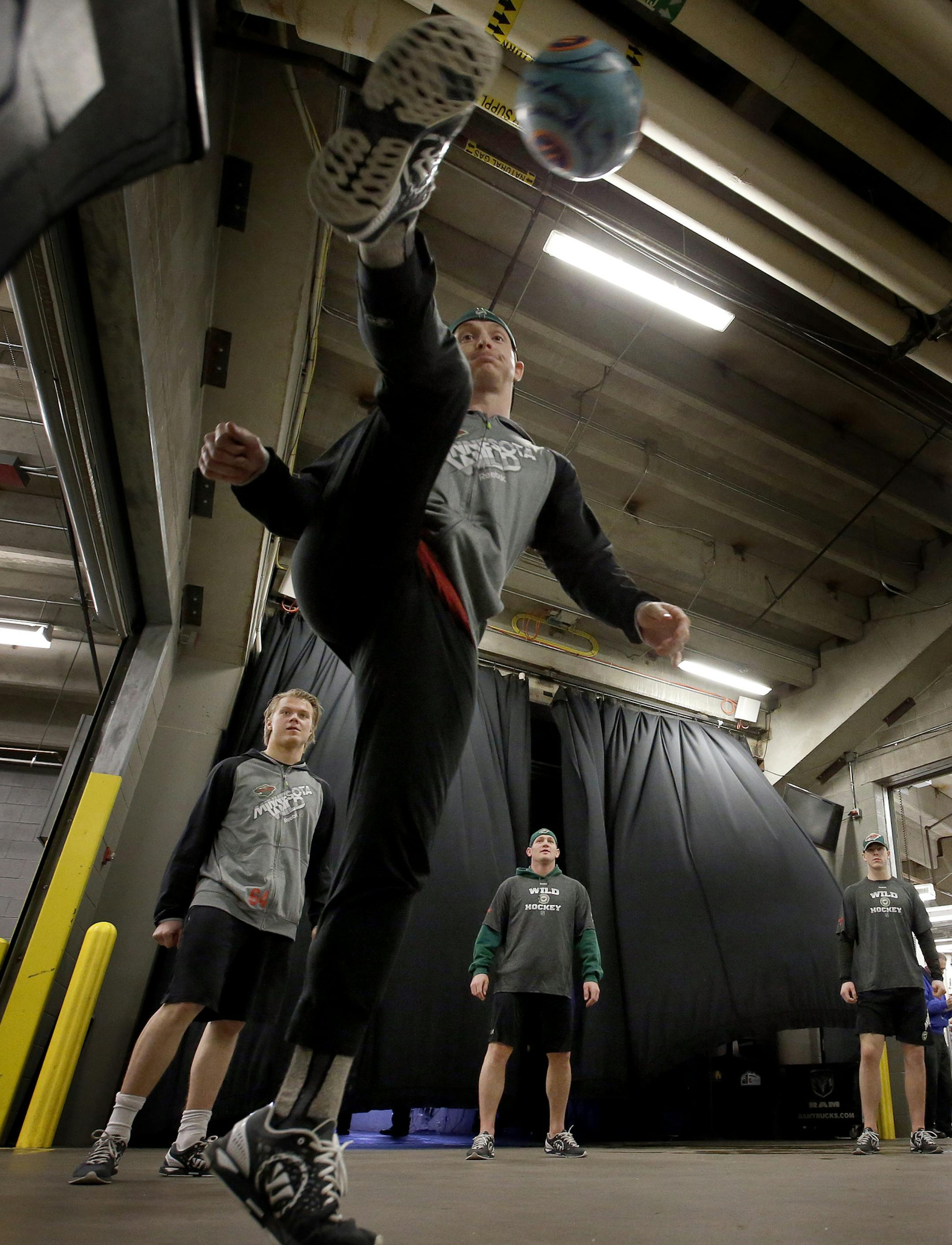 Minnesota Wild goalie John Curry and teammates warmed up with a soccer ball before game 1 against the Colorado Avalanche at the Pepsi Center in Denver. ] CARLOS GONZALEZ cgonzalez@startribune.com - April 17, 2014, Denver, Colorado, Pepsi Center, NHL, Minnesota Wild vs. Colorado Avalanche, Stanley Cup Playoffs round 1, Game 1