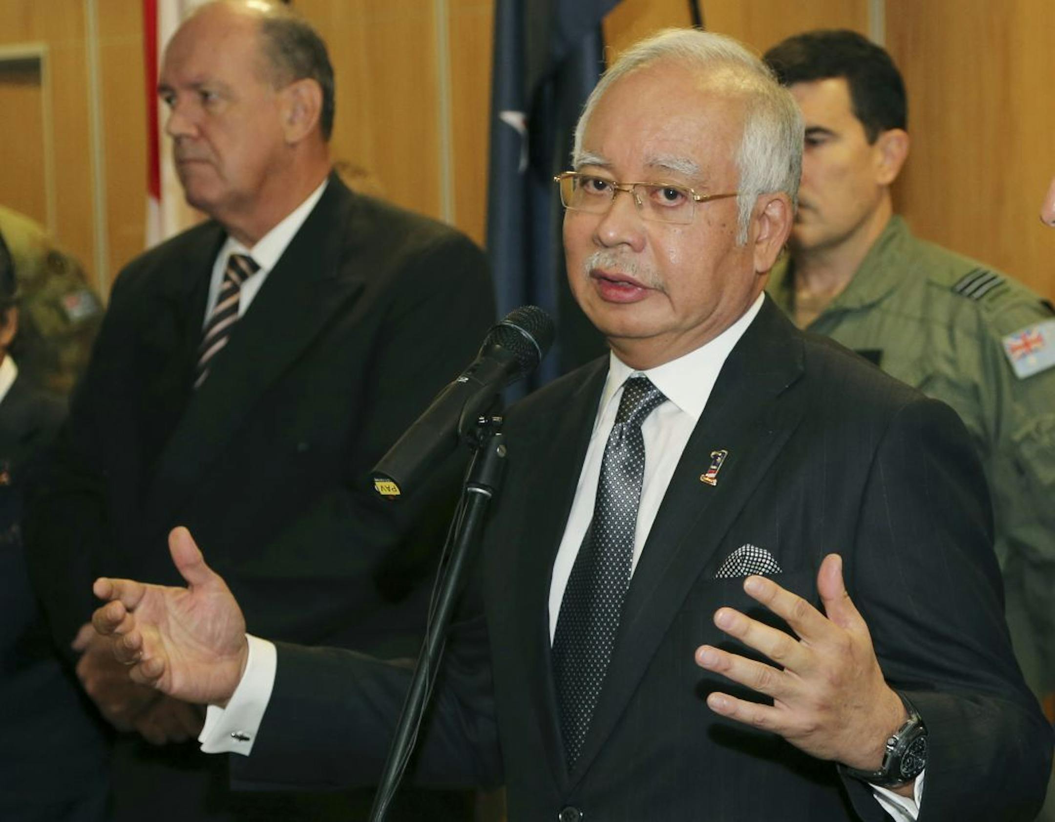 Malaysian Prime Minister Najib Razak speaks at a breakfast with crew members from different countries involved in the search for wreckage and debris of the missing Malaysia Airlines MH370 in Perth, Australia, Thursday, April 3, 2014.