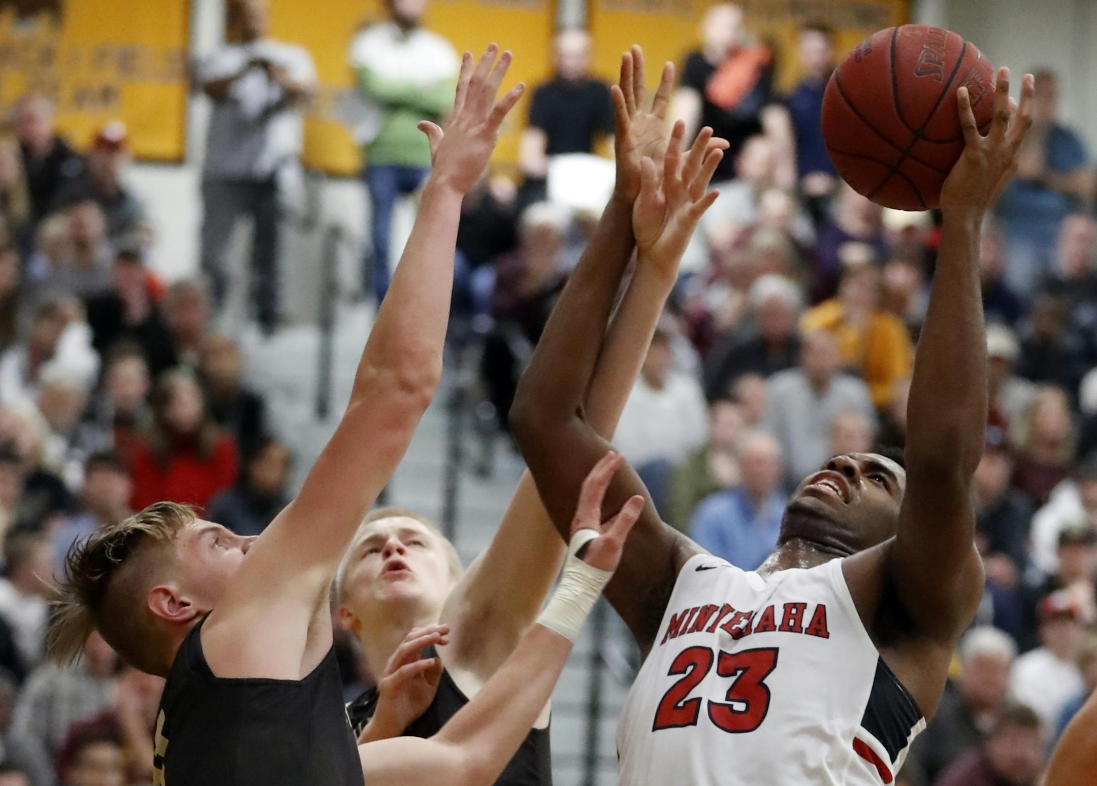 JaVonni Bickham(23) of Minnehaha goes up against the Apple Valley defense.