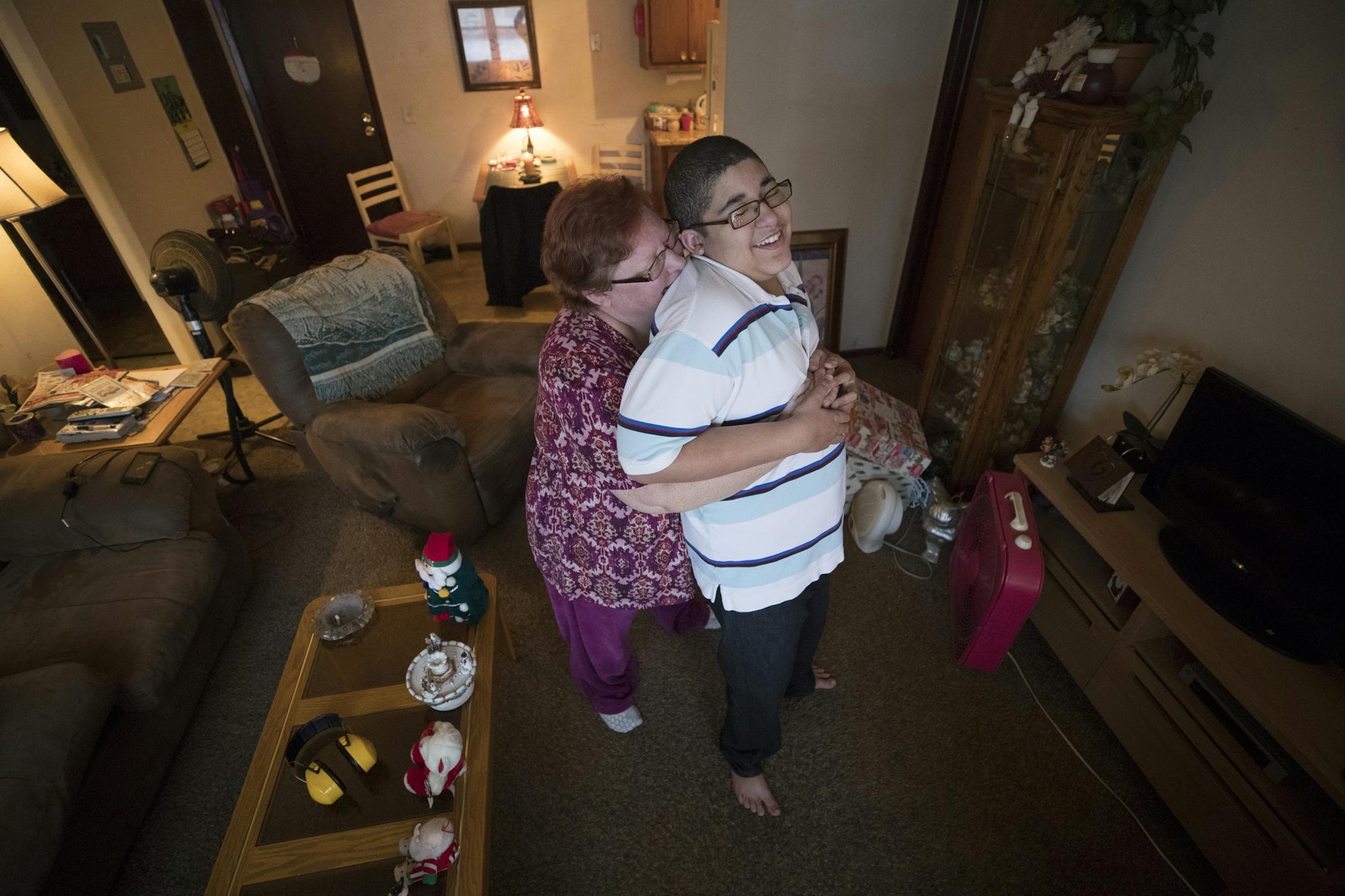 Cora Mustin played with her15-year-old son Jordan Mustin in their apartment after he arrived home from school Thursday December 14, 2017 in Mounds View, MN. Jordan has autism and a history of violent outbursts toward himself and family.