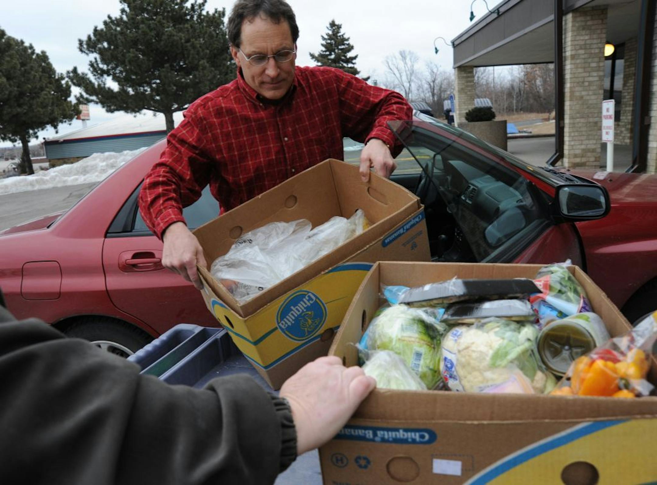 The Pantry in Eagan, Minn, is a food shelf that's part of the Eagan Resource Center, and has a goal this year of giving its clients 70 percent fresh and perishable food instead of a cart full of cans and boxed goods. Volunteers stock the shelves each morning with fruits and vegetables. John Jaeger is Operations Mgr. but helps out stocking and loading food
