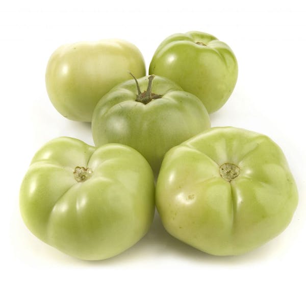 Green tomatoes have a tart flavor perfect for frying or pickling.