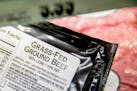Meat labels are seen at a grocery store in Washington, Tuesday, May 19, 2015. A House committee is moving swiftly to get rid of labels on packages of 