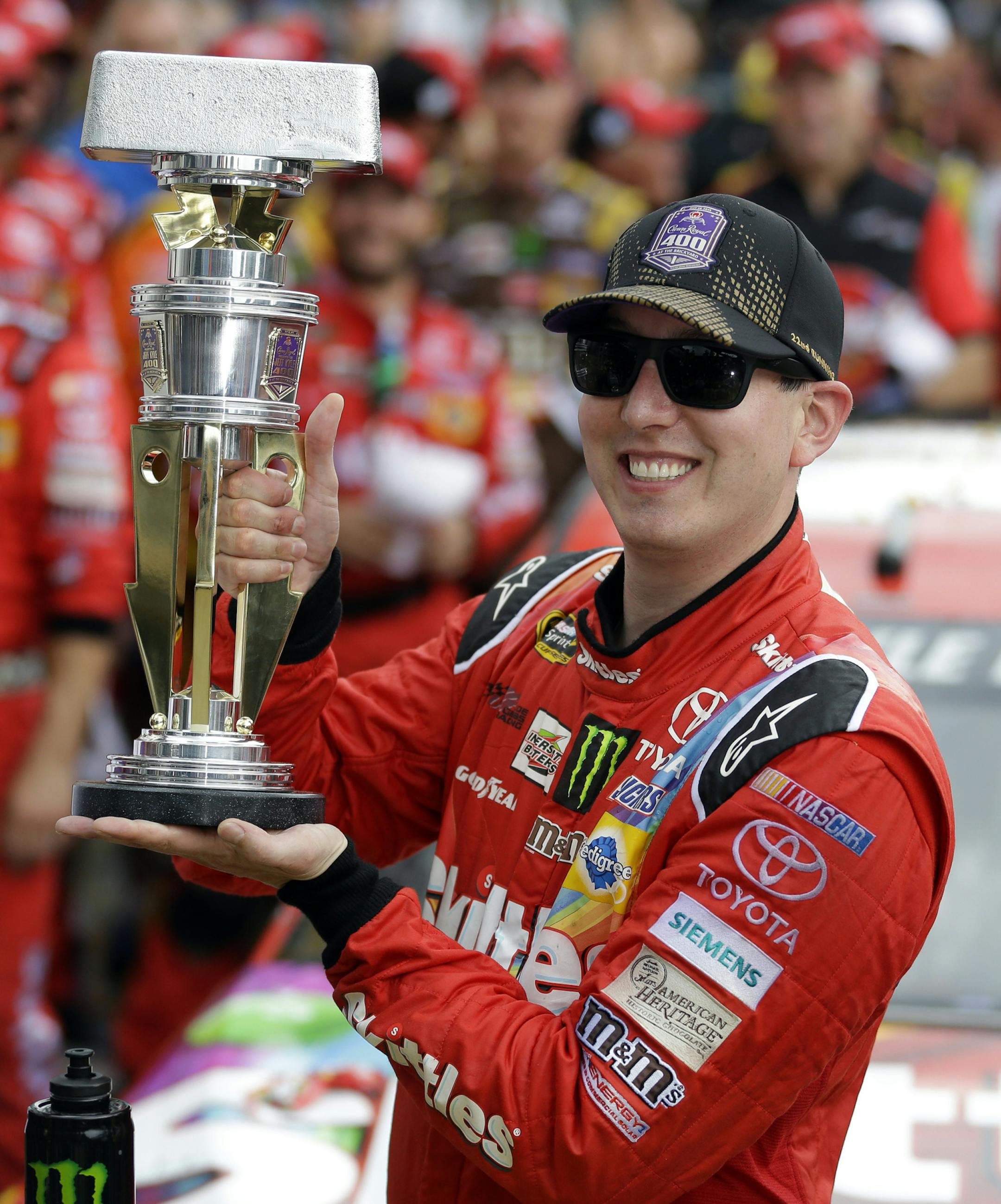 Kyle Busch celebrates after winning the NASCAR Brickyard 400 auto race at Indianapolis Motor Speedway in Indianapolis, Sunday, July 26, 2015. (AP Photo/Michael Conroy)