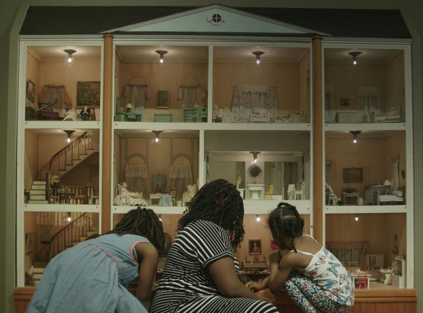 Andrea Pierre and her daughters Millicent and Josephine Anderson viewed the dollhouse at the Minneapolis Institute of Art.