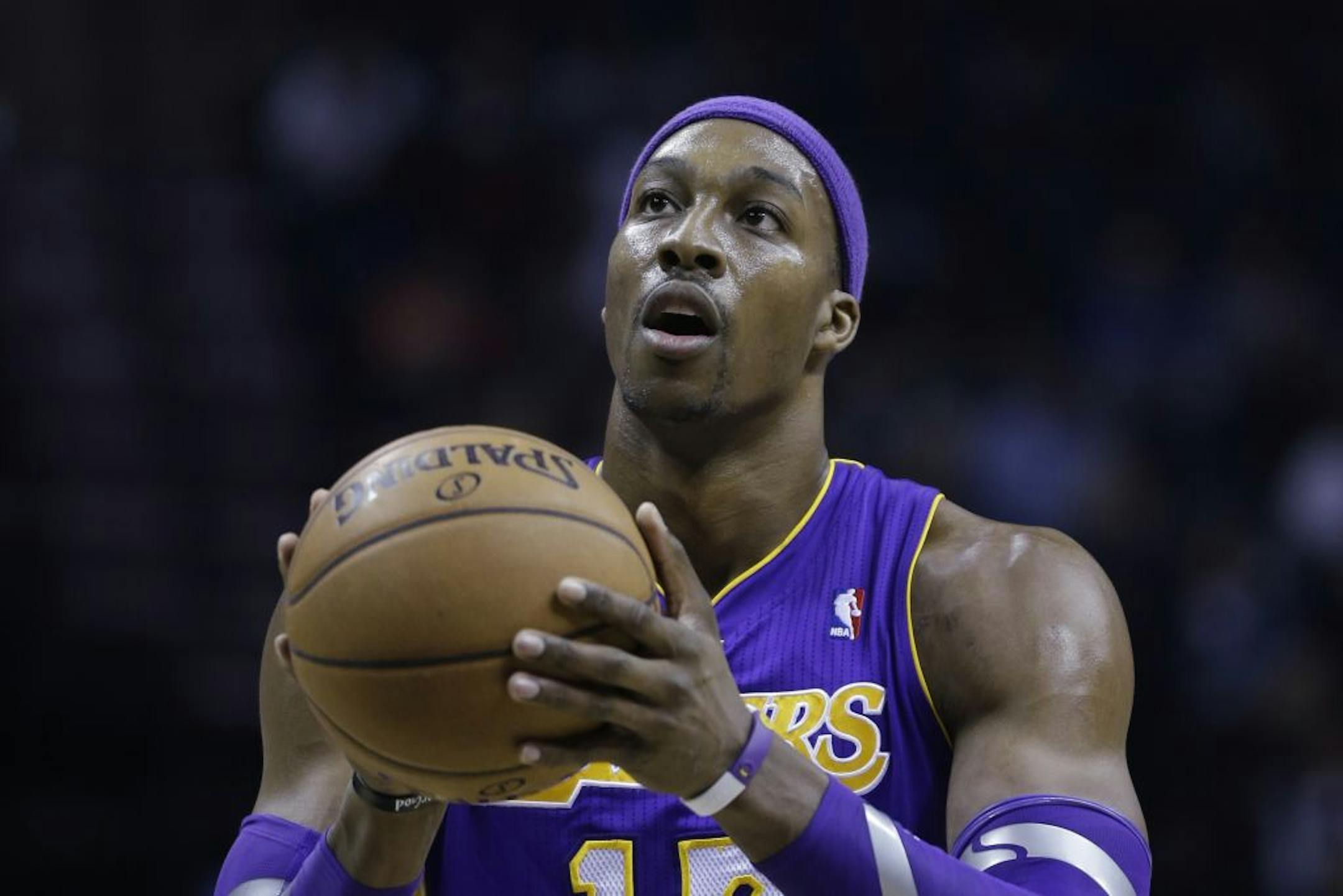 Los Angeles Lakers' Dwight Howard attempts a free-throw during the first half of an NBA basketball game against the Memphis Grizzlies in Memphis, Tenn., Wednesday, Jan. 23, 2013.
