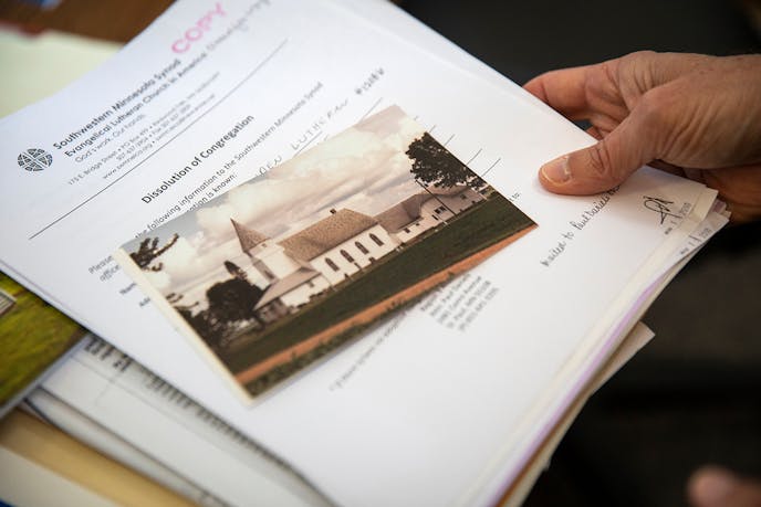 Paul Daniels held the official document dissolving Linden Lutheran Church. The closed church's files are part of the archives at Luther Seminary.
