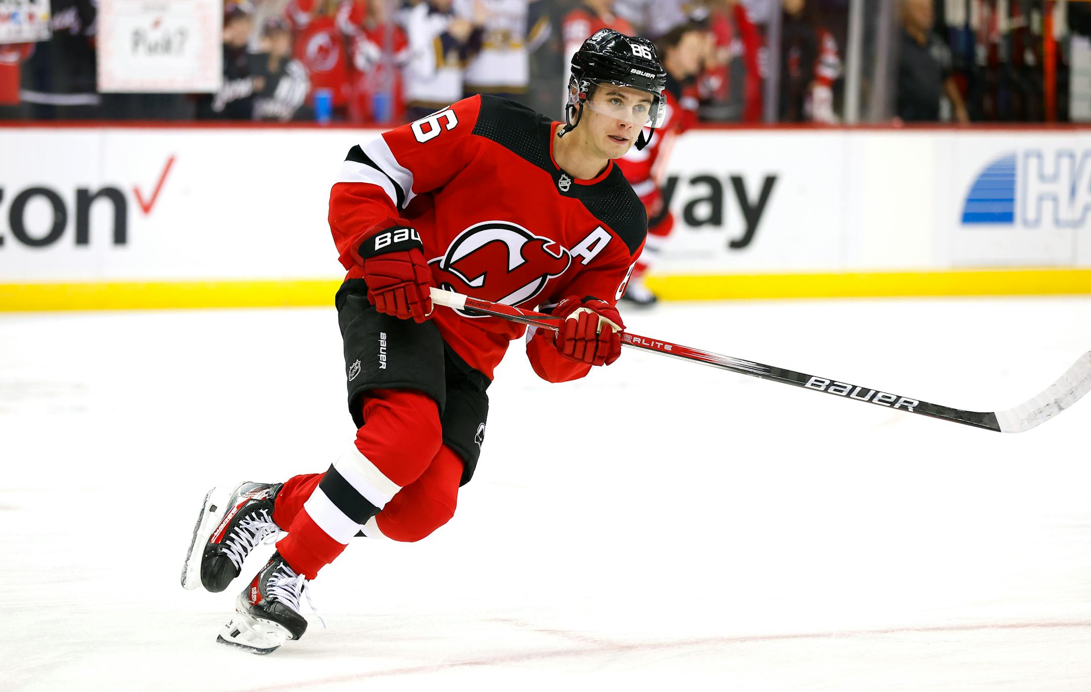 New Jersey Devils center Jack Hughes (86) skates during a warm up before an NHL hockey game against the Minnesota Wild, Sunday, Oct. 29, 2023, in Newark, N.J. (AP Photo/Noah K. Murray)