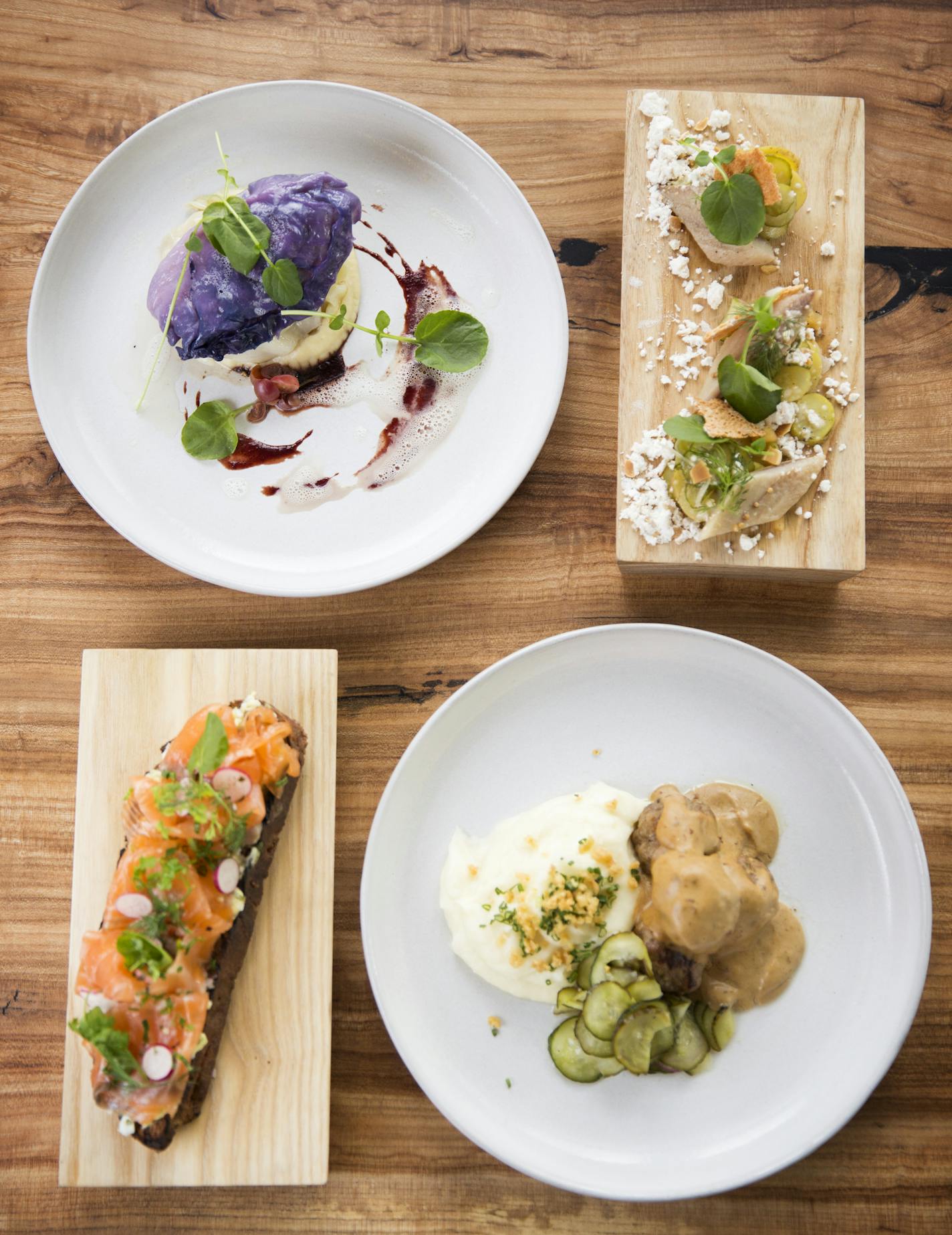 Clockwise from top left, cod with cabbage, pickled herring, gravlax sm&#xf6;rrebrod and Swedish meatballs at Upton 43.