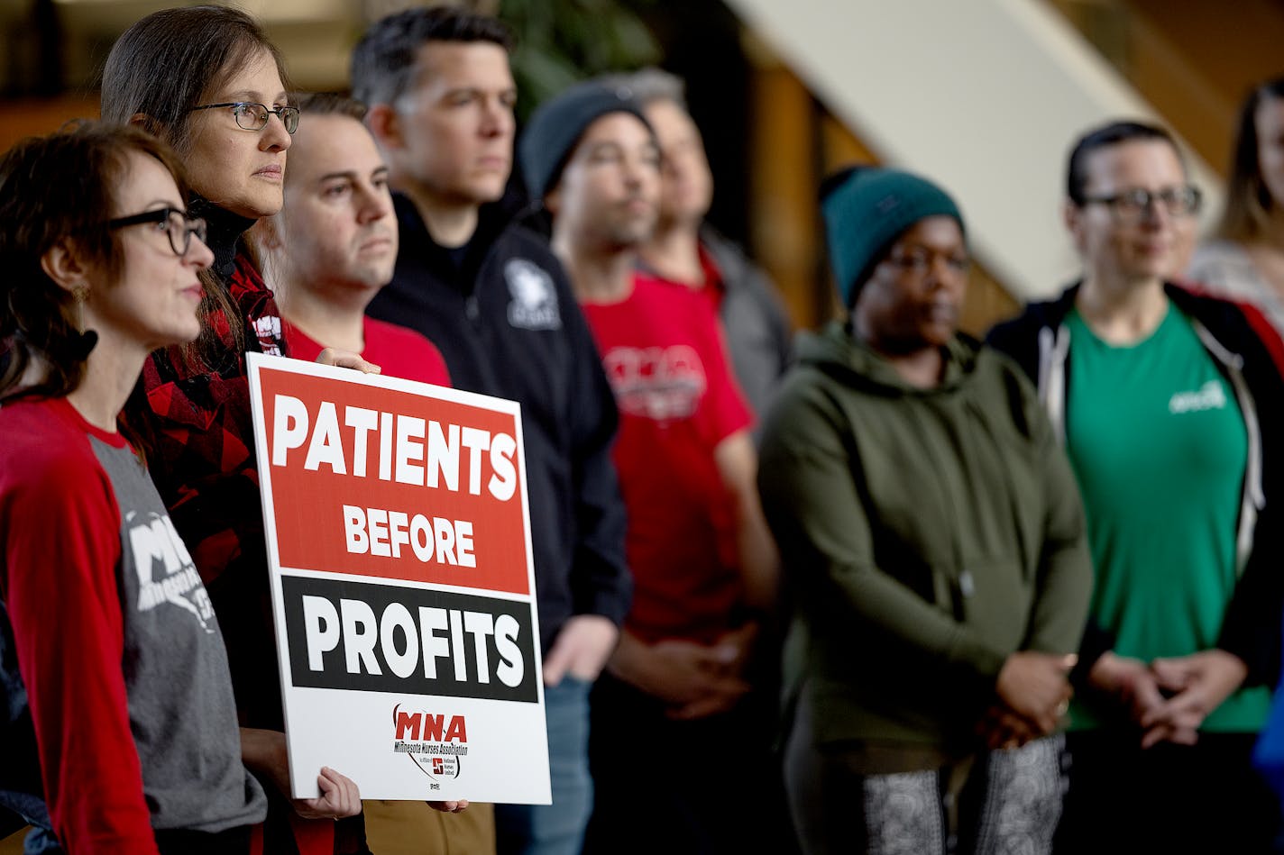 The Minnesota Nurses Association hold a news conference to discuss health insurance costs and a no-confidence vote on the HCMC president in Minneapolis, Minn., on Tuesday, Nov. 28, 2023. They are angry about rising health care costs and a plan change they say will push more workers to HCMC for care. ] Elizabeth Flores • liz.flores@startribune.com