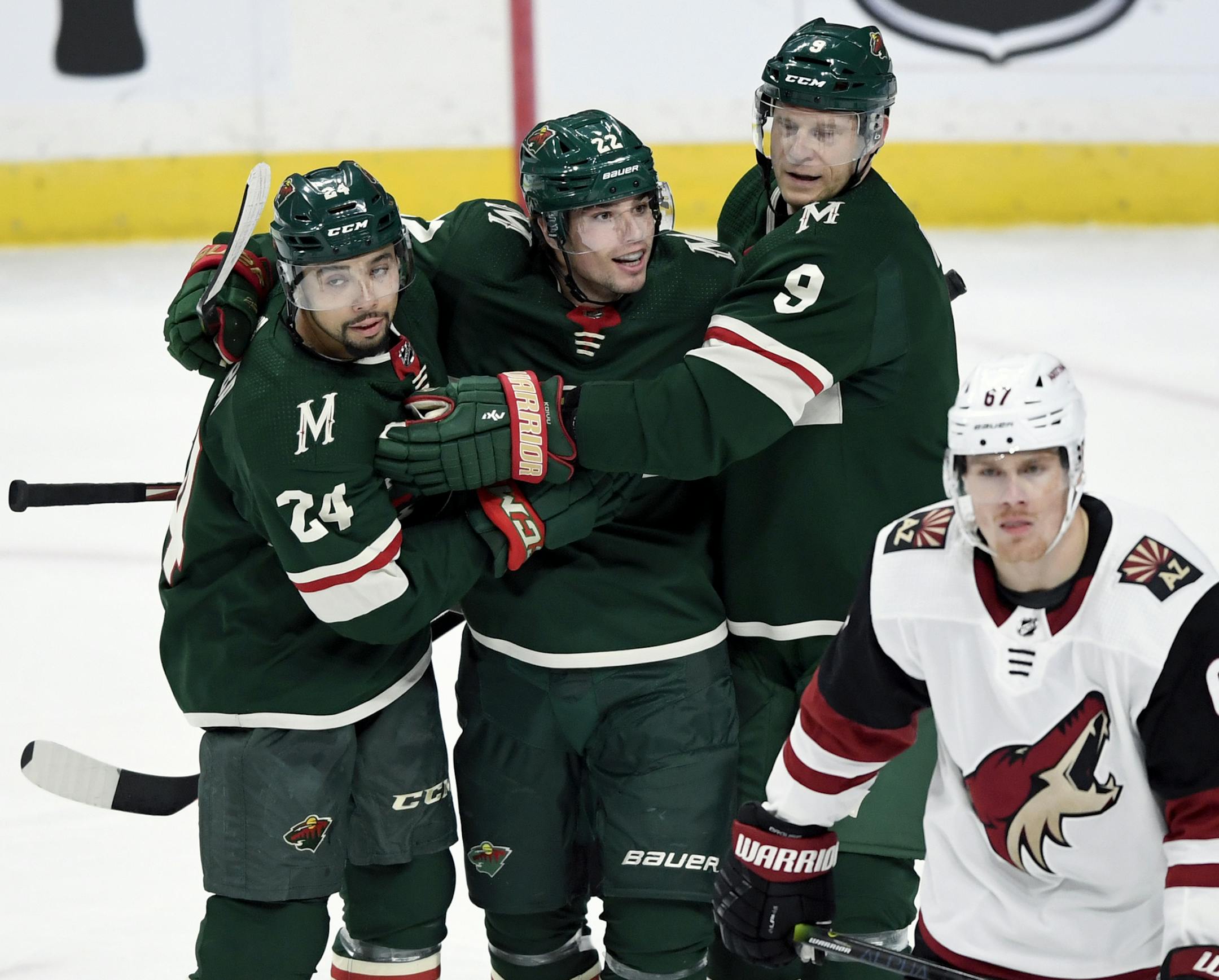 The Wild's Matt Dumba and Mikko Koivu congratulate Kevin Fiala on his goal