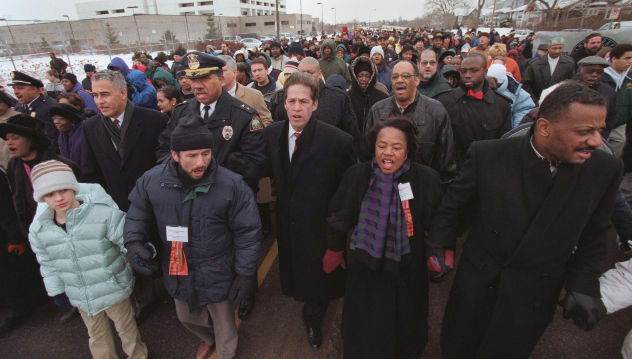 St. Paul, MN. Monday, 1/17/2000. (left to right) Kelsey Peterson of St. Paul, Senator Paul Wellstone, St. Paul Police Chief William Finney, St. Paul Mayor Norm Coleman, Minneapolis Mayor Sharon Sayles Belton and Tyrone Terrill, St. Paul Director of Human Rights led hundreds of people as they marched from St. Paul Central High as part of Martin Luther King day celebration. The Martin Luther King day rally and march began at 9 a.m. at Central High School with speeches by Senator Paul Wellstone, pe
