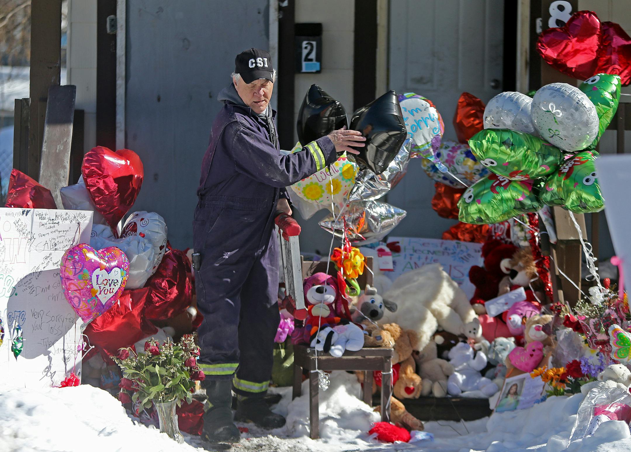 Ron Rahman, from the State Fire Marshall Division, investigated the home on Colfax Avenue North where five children died in a house fire, Wednesday, February 19, 2014 in Minneapolis, MN. (ELIZABETH FLORES/STAR TRIBUNE) ELIZABETH FLORES • eflores@startribune.com