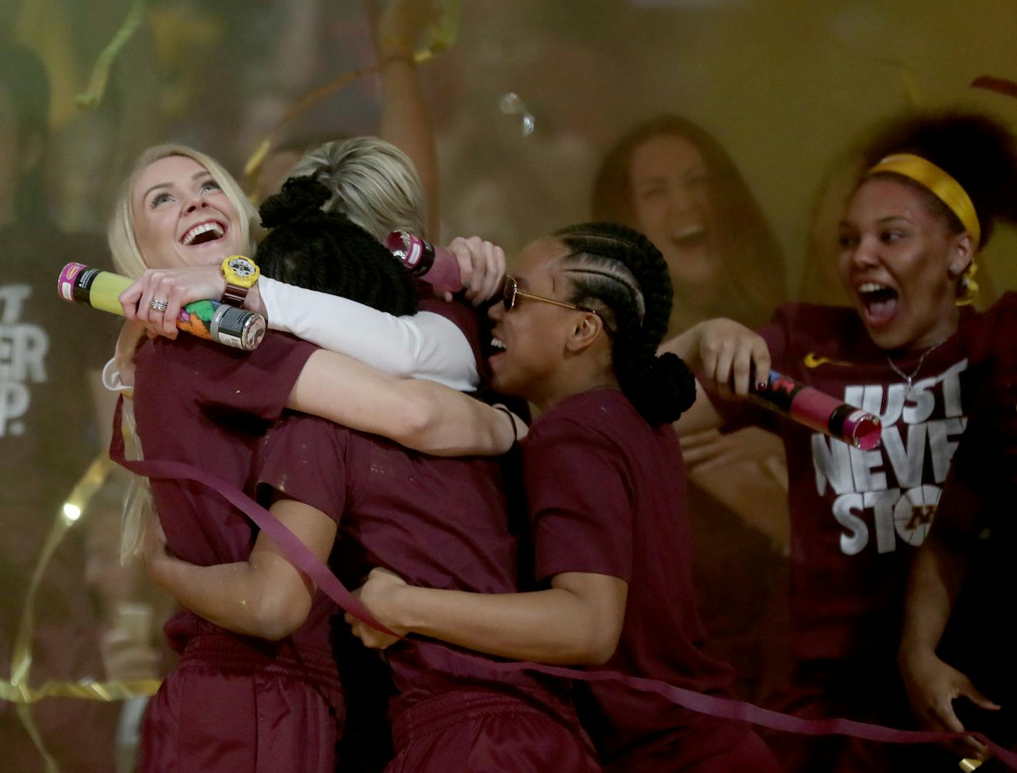 Gophers senior guard Carlie Wagner looked up at the giant screen while hugging coach Marlene Stollings and fellow guard Kenisha Bell.