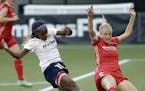 CORRECTS FINAL SCORE TO 3-3 FROM 2-2. Washington Spirit defender Crystal Dunn, left, takes a shot on goal as Portland Thorns defender Kat Williamson d