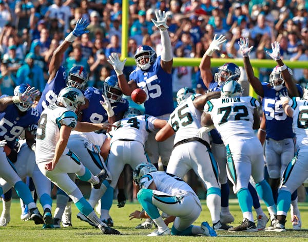 Carolina Panthers' Graham Gano (9) kicks the game-winning field goal against the New York Giants in the second half of an NFL football game in Charlot
