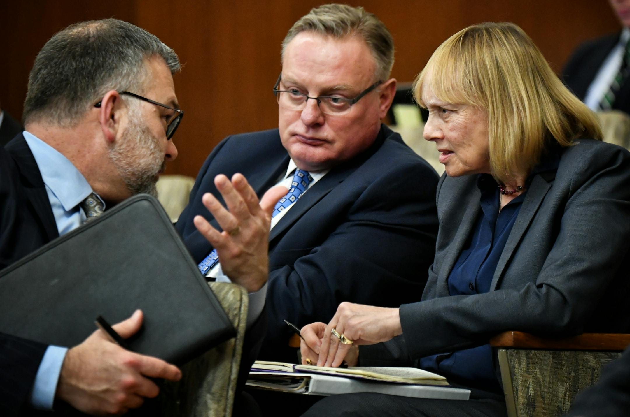 Ted Mondale and Michele Kelm-Helgen talked with MSFA counsel Jay Lindgren as Minnesota Legislative Auditor James Nobles brought up the subject of a possible third luxury suite.