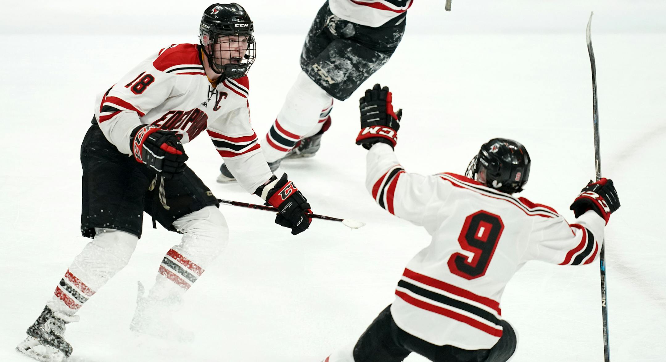 Eden Prairie forward Jack Jensen (18) celebrated with forward John Mittelstadt (9) after scoring the game winning goal with less than a minute to play in triple overtime. ] ANTHONY SOUFFLE &#x2022; anthony.souffle@startribune.com Lakeville South High School played Eden Prairie High School in a MSHSL Class 2A boys hockey quarterfinal game Thursday, March 7, 2019 at the Xcel Energy Center in St. Paul, Minn.