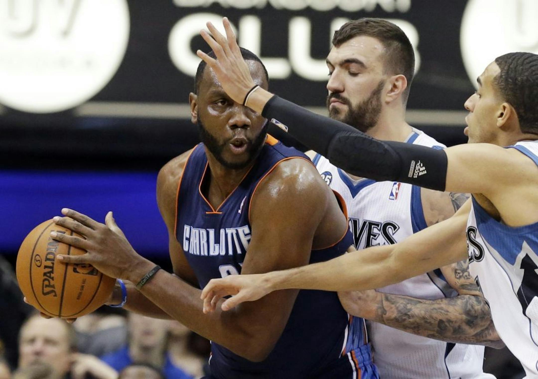 Charlotte Bobcats' Al Jefferson, left, is double-teamed by Minnesota Timberwolves' Nikola Pekovic, center, and Kevin Martin during the first quarter of an NBA basketball game Friday, Jan. 10, 2014, in Minneapolis. Jefferson was held to 8 points. The Timberwolves won 119-92.