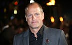 FILE - In a Thursday, Nov. 5, 2015 file photo, Woody Harrelson poses for photographers upon arrival at the premiere of the film 'The Hunger Games Mock