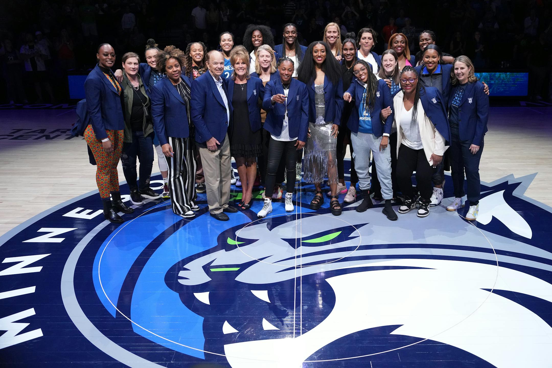 Minnesota Lynx greats stand for a photo on the court during a postgame ceremony with 19 of the top 25 players of the All-25 Team in attendance Friday