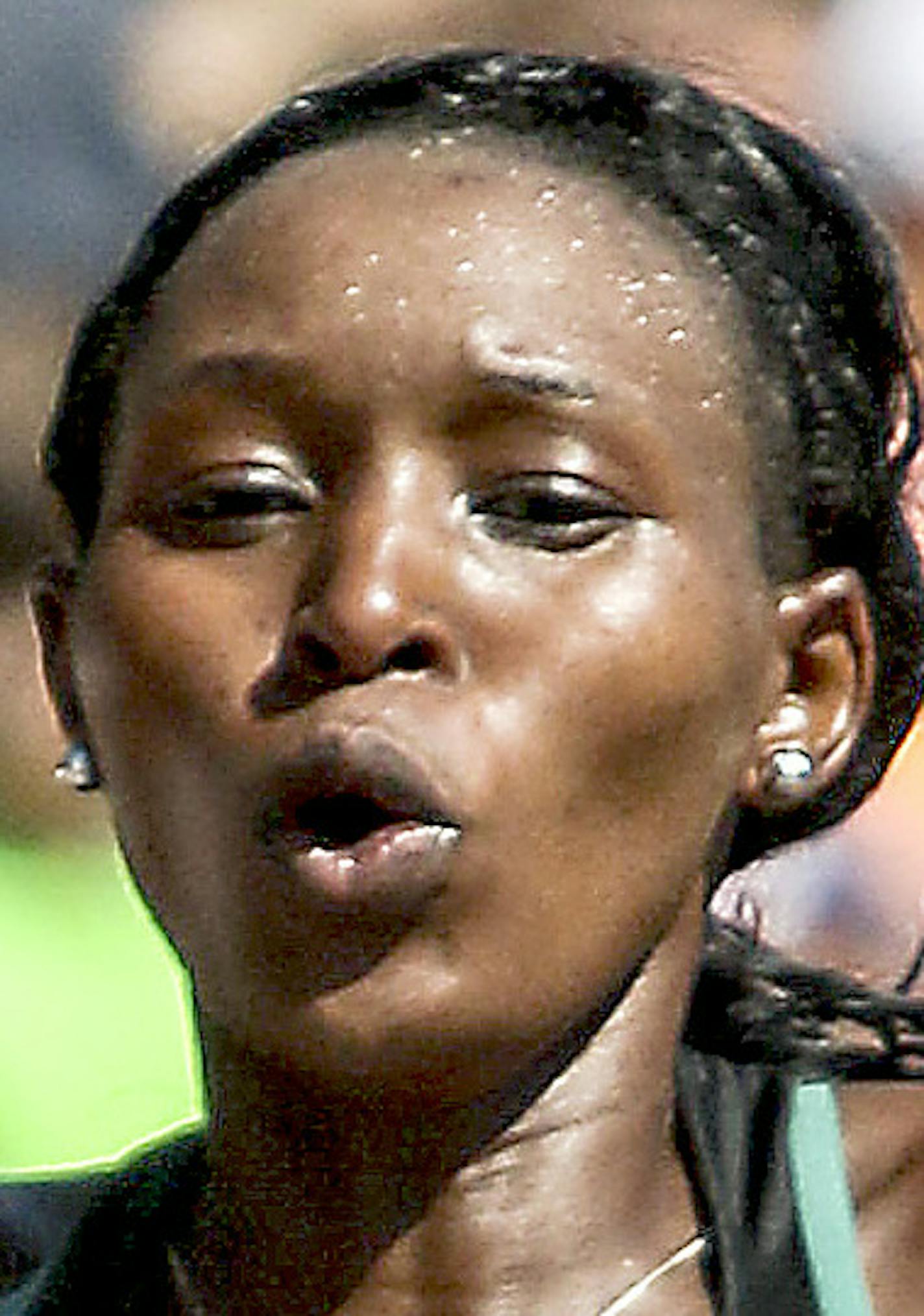 t061816 --- Clint Austin --- austinGMA0619c --- Sarah Kipto celebrates at the finish line of Grandma's Marathon in Duluth Saturday. Kipto won with a time of 2:33:29 (Clint Austin / caustin@duluthnews.com)