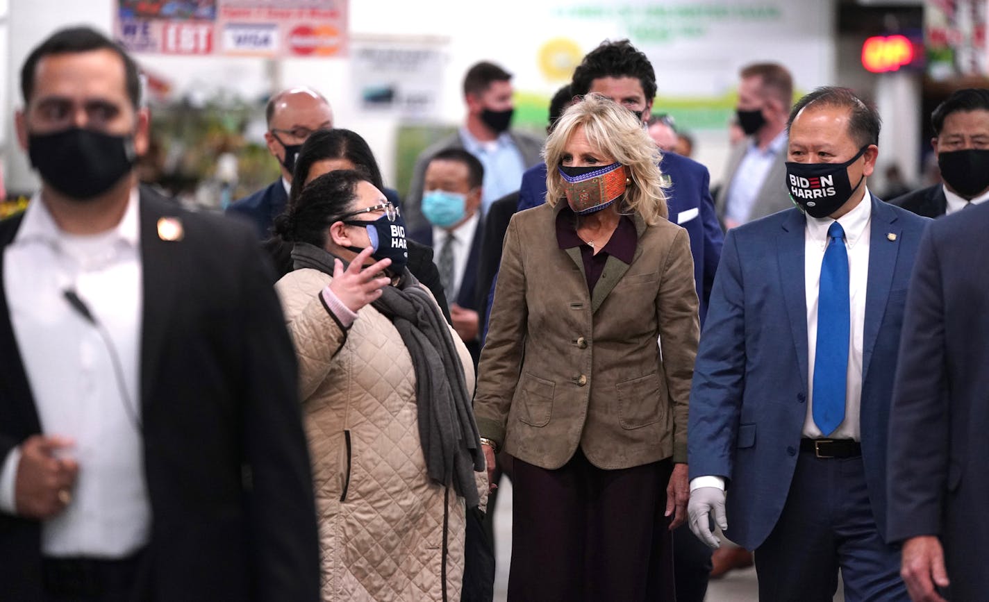 Dr. Jill Biden visited the Hmong Village Shopping Mall with Pakou Hang, left, in St. Paul Thursday. ] Anthony Souffle / Star Tribune