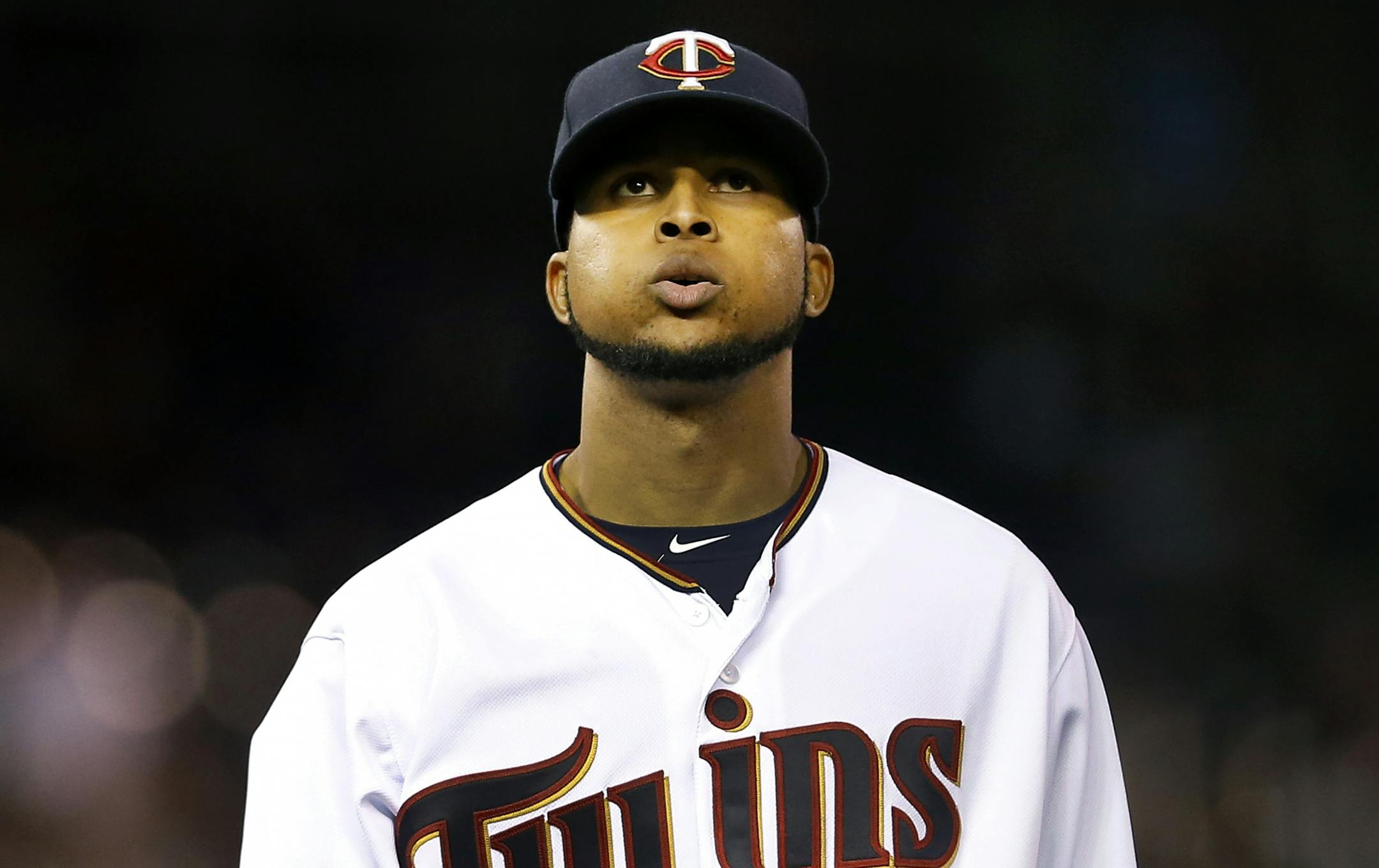 Minnesota Twins starting pitcher Ervin Santana (54) walked back to the dugout in the seventh inning.