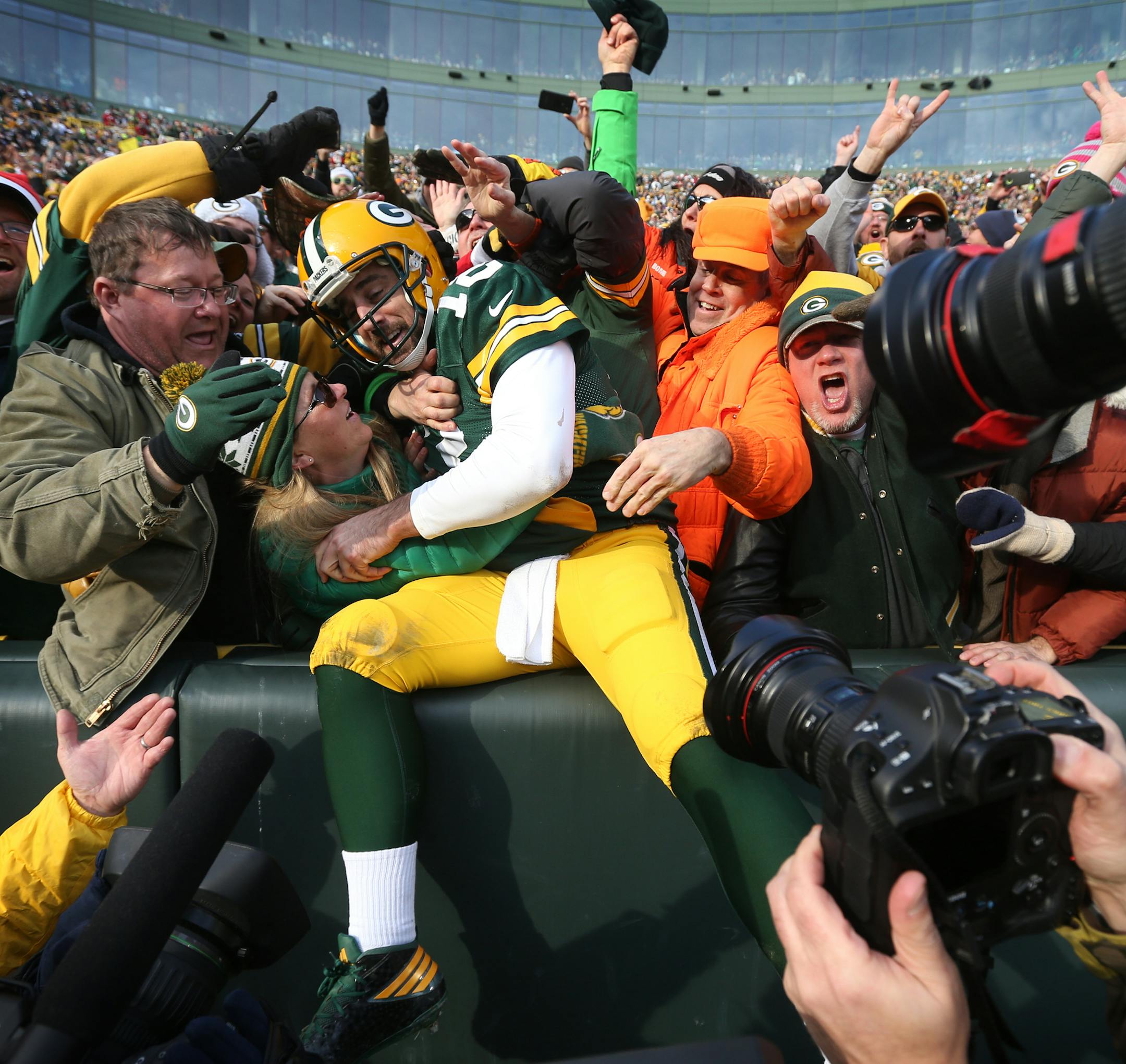 Green Bay Packers quarterback Aaron Rodgers (12) celebrated his second quarter rushing touchdown with fans at Lambeau Field Saturday December 24,2016 in Green Bay, Wis. ] The Green Bay Packers hosted the Minnesota Vikings at Lambeau Field. Jerry Holt / jerry. Holt@Startribune.com