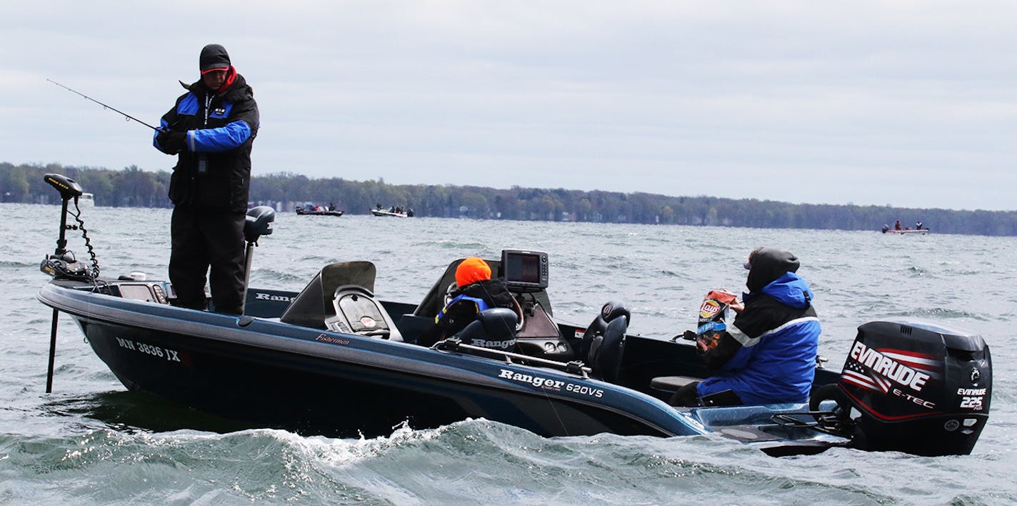 Mille Lacs anglers fought wind and cold early Saturday, but the bite was steady. Crowds were substantially smaller than a year ago.