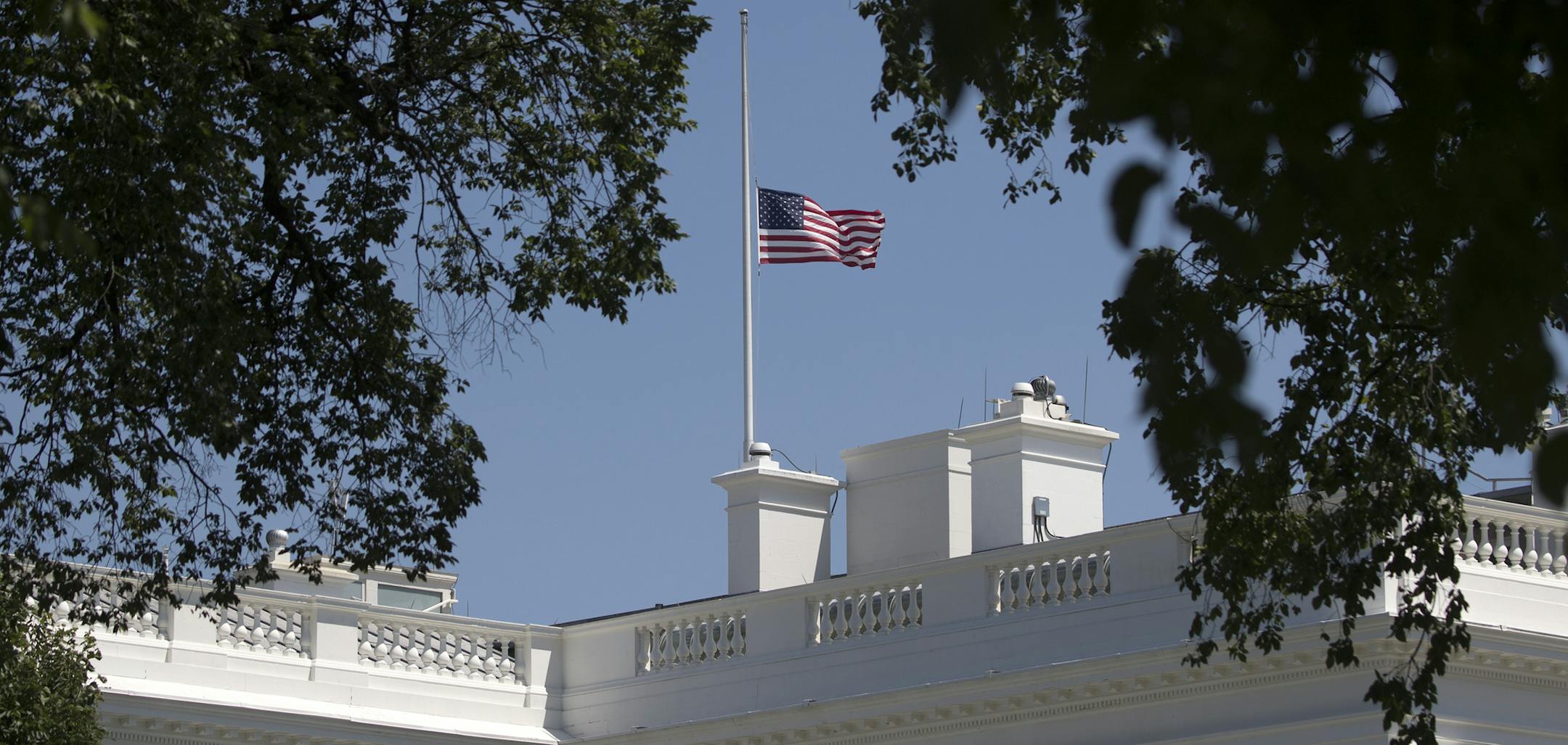 The flag flies at half-staff over the White House in Washington in remembrance of the victims of the mass shooting in Orlando, June 12, 2016. In an address on Sunday, President Barack condemned the worst mass shooting in the nation's history and vowed to respond forcefully to the devastating act of terror at a gay nightclub. (Stephen Crowley/The New York Times)
