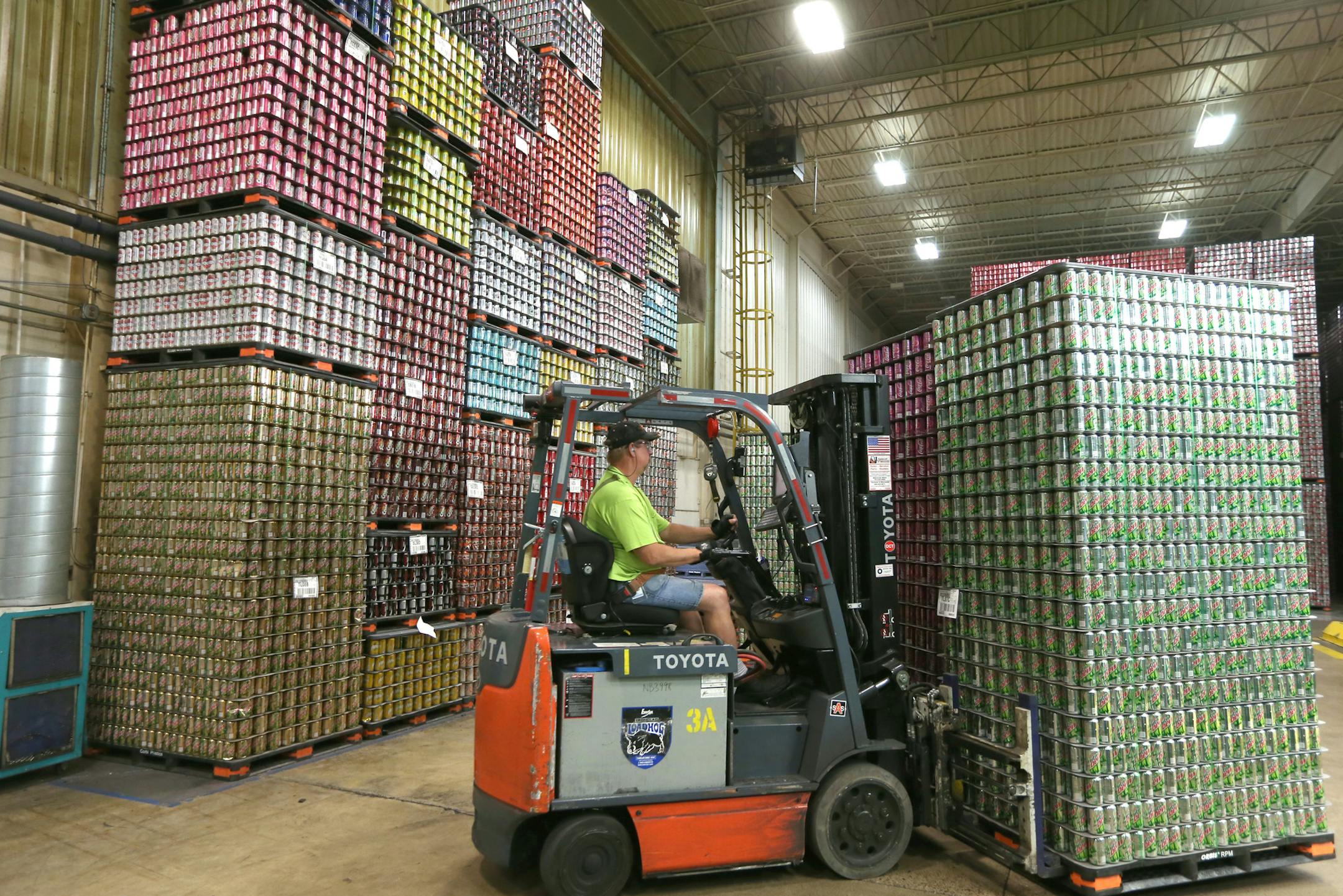 Kim Perkins movied finished pallets of aluminum cans at the Rexam Plant in St. Paul, to be shipped to Coke, Pepsi and other plants around the mid-west. Minnesotans only recycle 40% of all beer and soda cans. The nation recycles 58% of all cans. Yet the metal is easily recycled and increasingly going into cars and other items. Rexam Beverage Can Co. in St. Paul makes cans for Coke and Pepsi, etc and just made 1,200 cans for the state fair recycling exhibit. About 68% of Rexam's cans are made of r