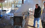 Jim Smith, left, Dave Swager and Vince Anderson, right, boil maple sap as as their animal spring syrup making ritual began in earnest last week.