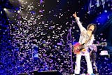 In an undated handout photo, Prince performs in Birmingham, England. In his latest confounding move, Prince has simultaneously released two albums: ìArt Official Age,î a studio production billed as his first solo album since 2010 and ìPlectrumElectrum,î on which heís backed by the three-woman rock trio he has been touring with, 3rdEyeGirl.