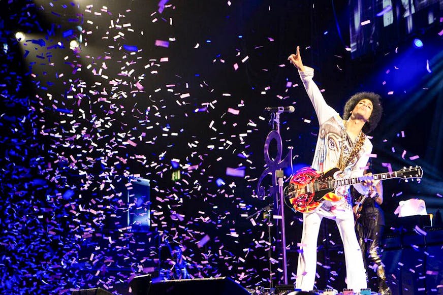 In an undated handout photo, Prince performs in Birmingham, England. In his latest confounding move, Prince has simultaneously released two albums: ìArt Official Age,î a studio production billed as his first solo album since 2010 and ìPlectrumElectrum,î on which heís backed by the three-woman rock trio he has been touring with, 3rdEyeGirl.