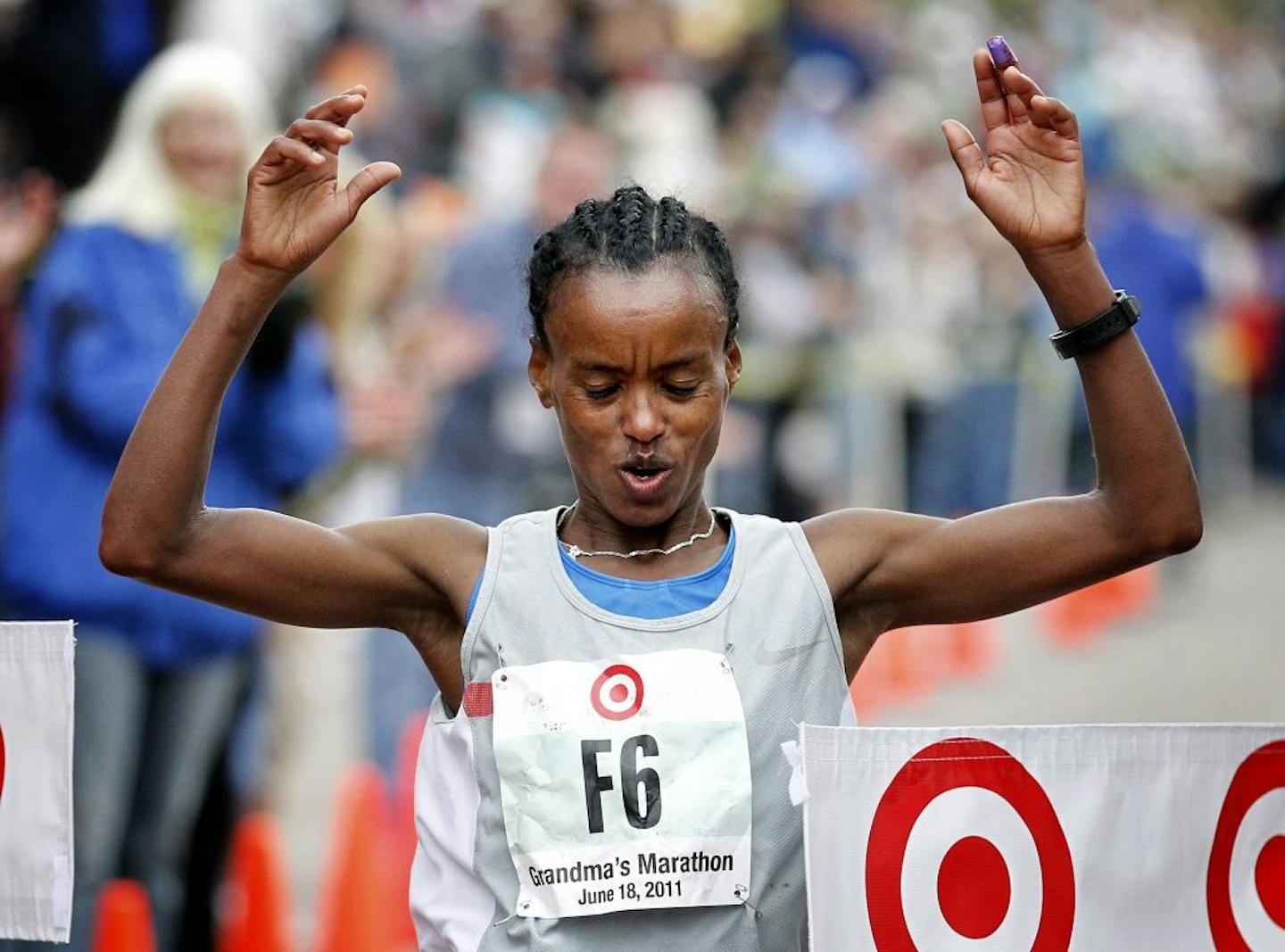 Yihunlish Bekele Delelecha crossed the finish line to win the women's division with a time of 2:30:38.