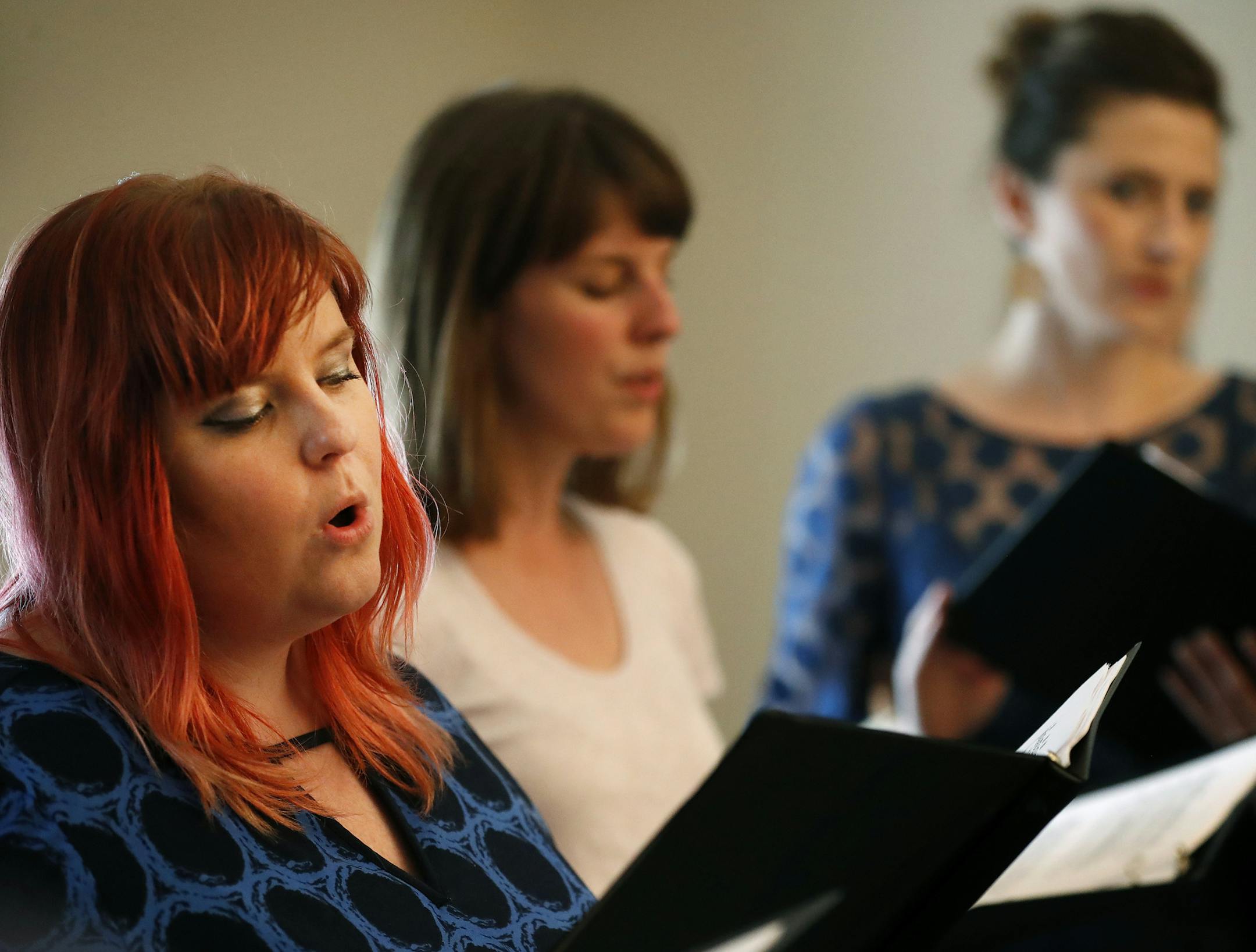 Erica Hanna, Sarah Super and Emily Coisman sang during a choir practice for survivors of sexual assault. The group will perform at Break the Silence Day on Wednesday.