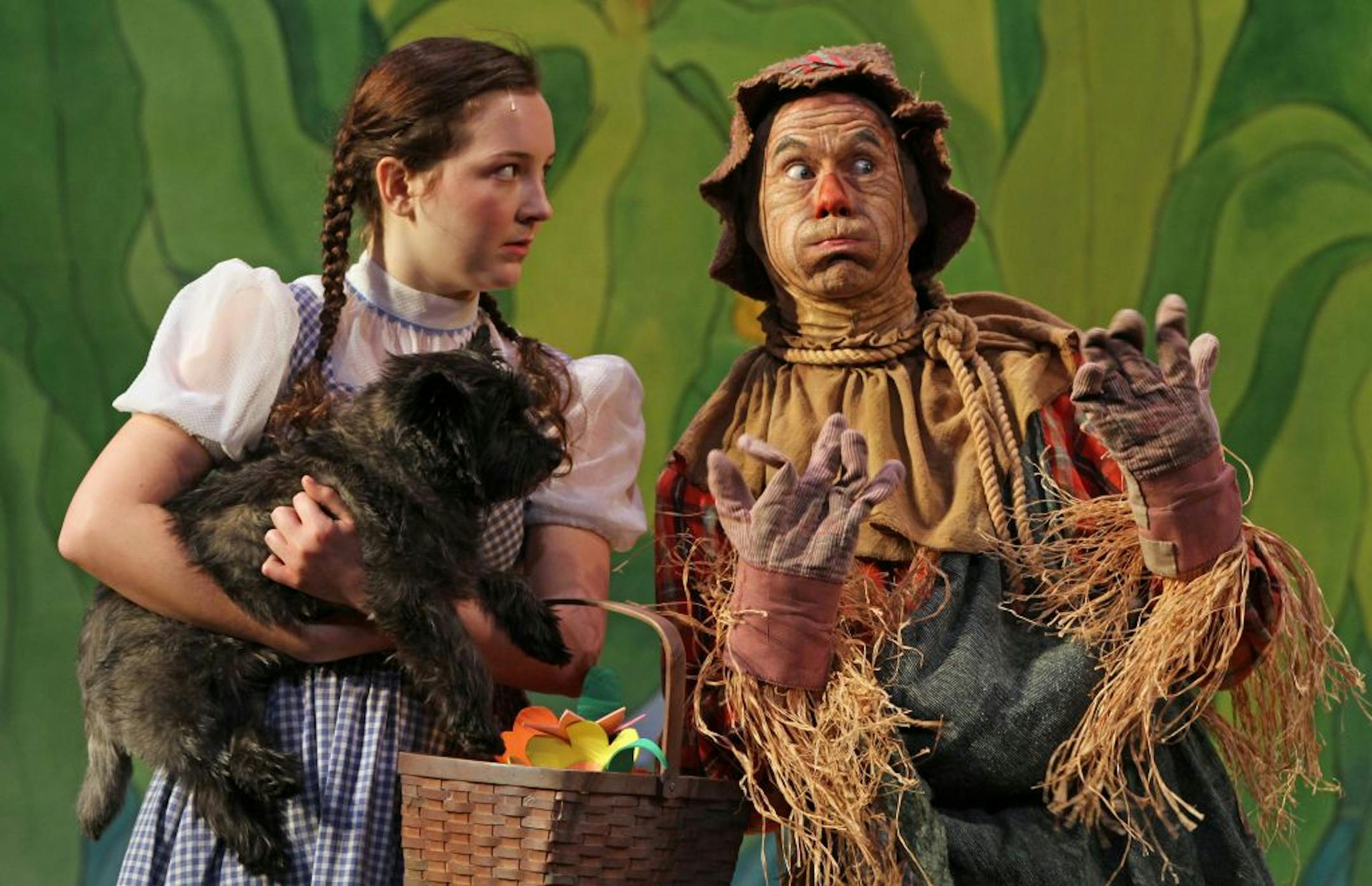 Maeve Coleen Moynihan as Dorothy, Loki as Toto and Dean Holt as the Scarecrow in "The Wizard of Oz."