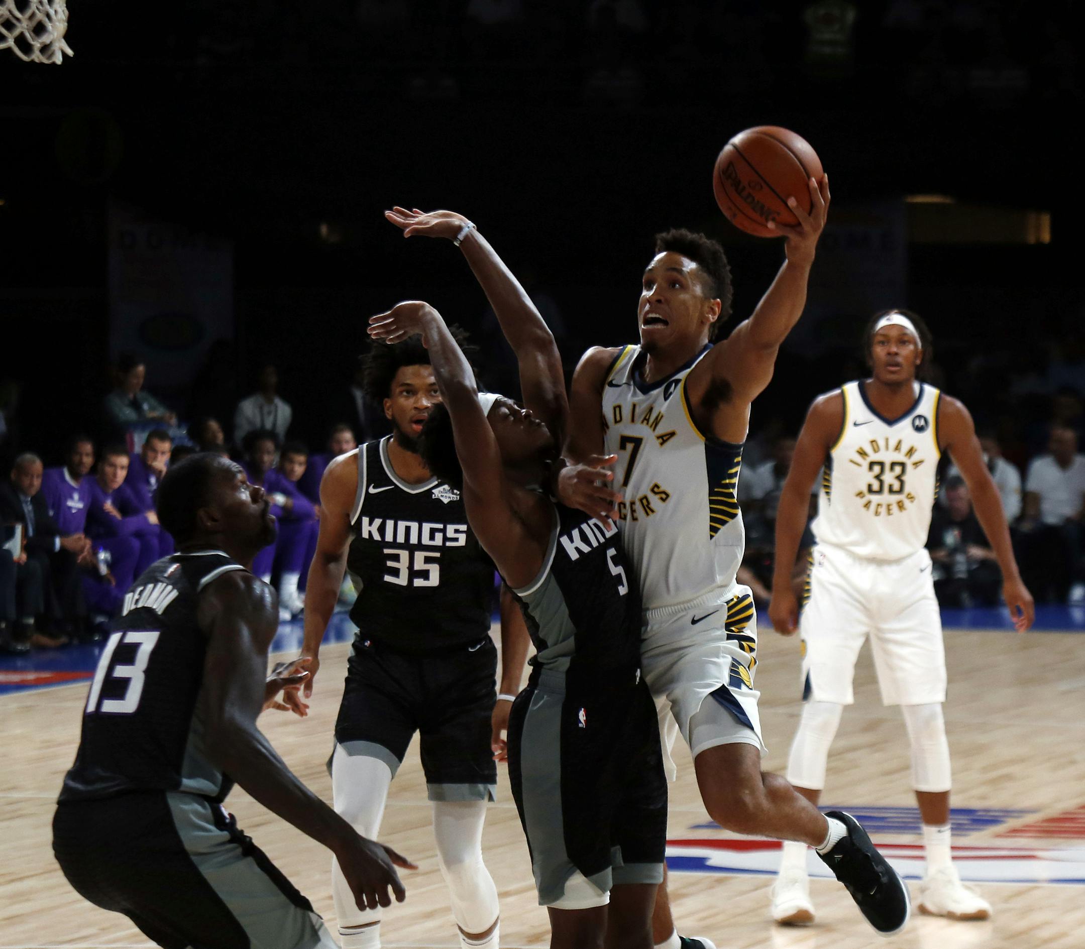 Indiana Pacers' player Malcolm Brogdon controls the ball during a match against Sacramento Kings during the NBA India Games 2019, in Mumbai, India, Saturday, Oct. 5, 2019. (AP Photo/Rajanish Kakade)
