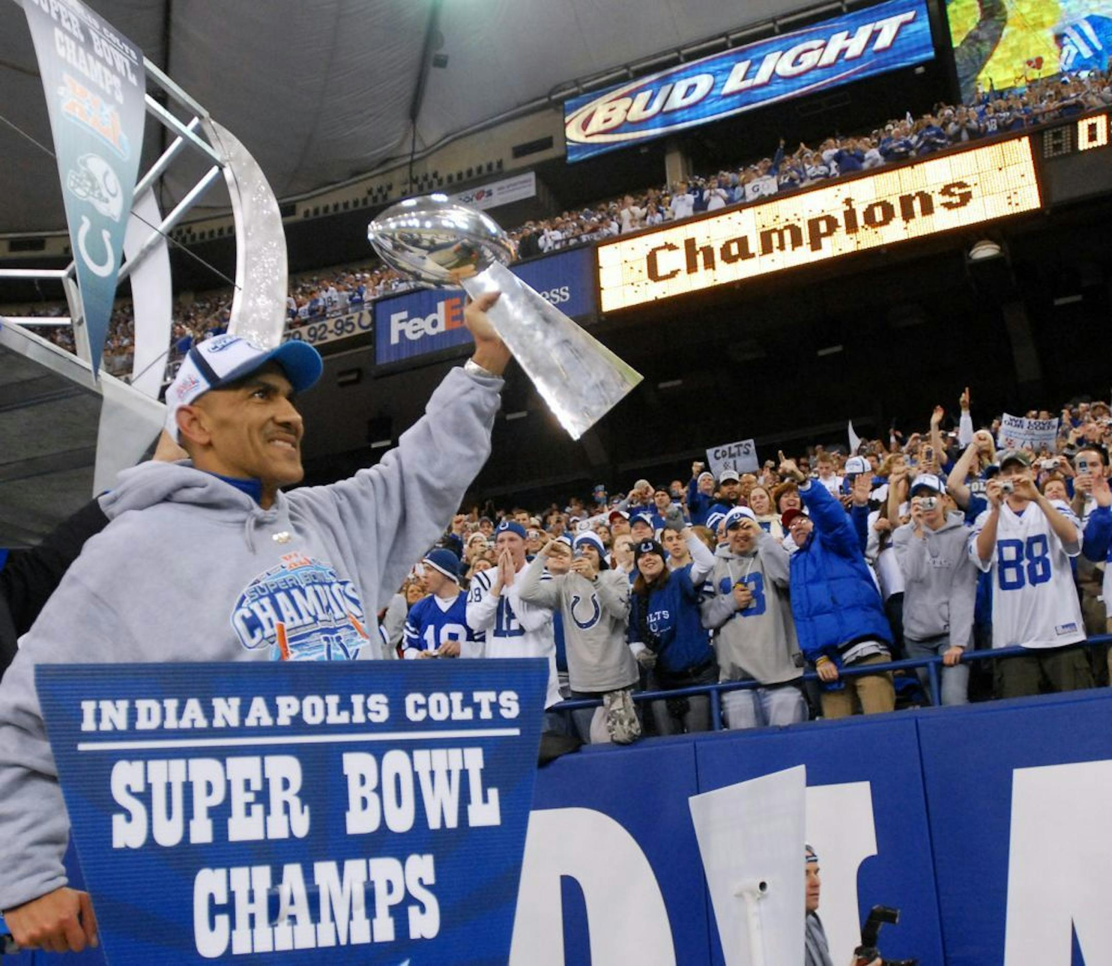 FILE - In this Feb. 5, 2007, file photo, Indianapolis Colts coach Tony Dungy shows the Vince Lombardi Trophy to fans while riding a float in the RCA Dome at a Super Bowl Rally in Indianapolis. Dungy is a finalist for the Pro Football Hall of Fame.